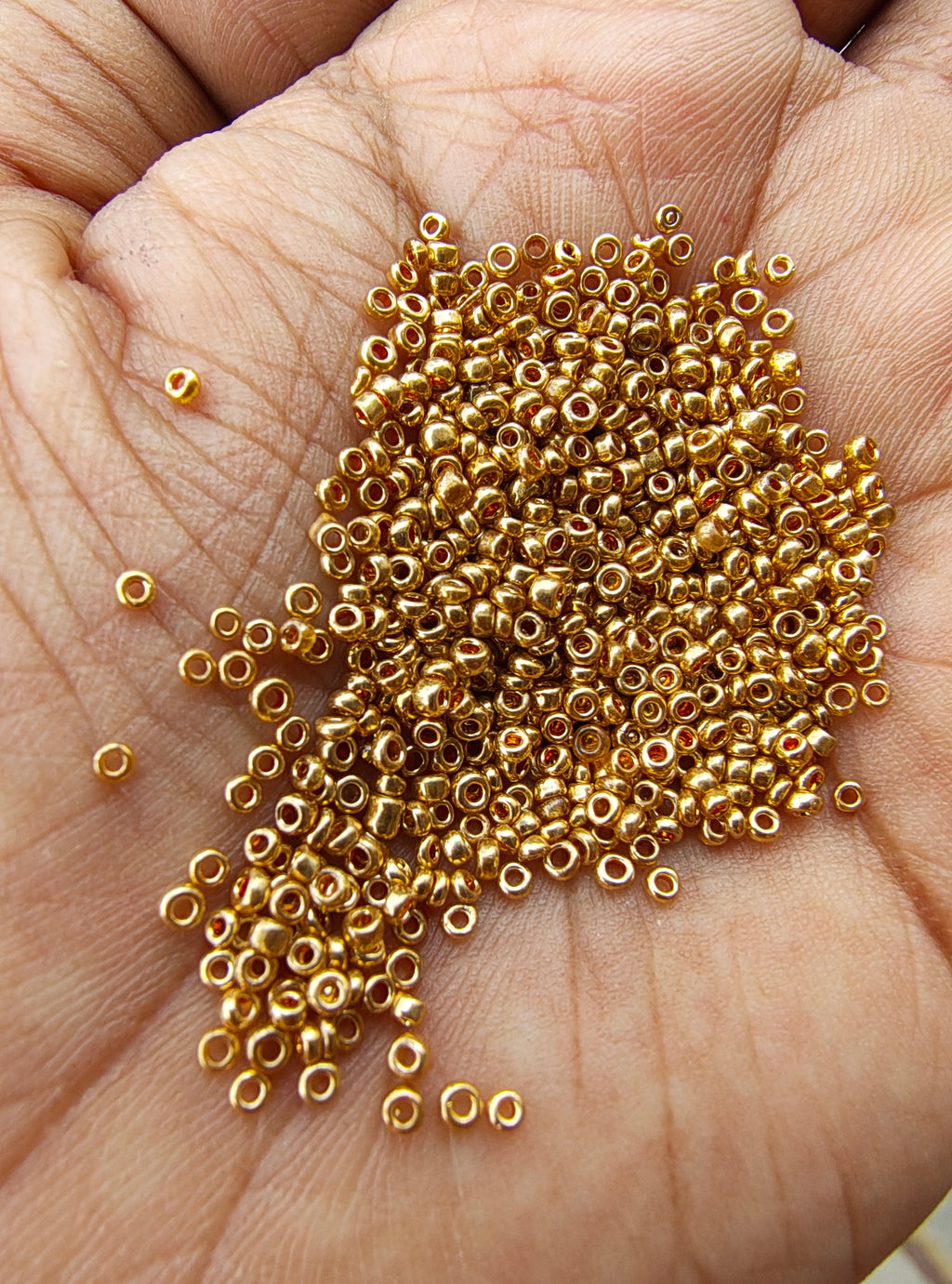 Small golden seed beads