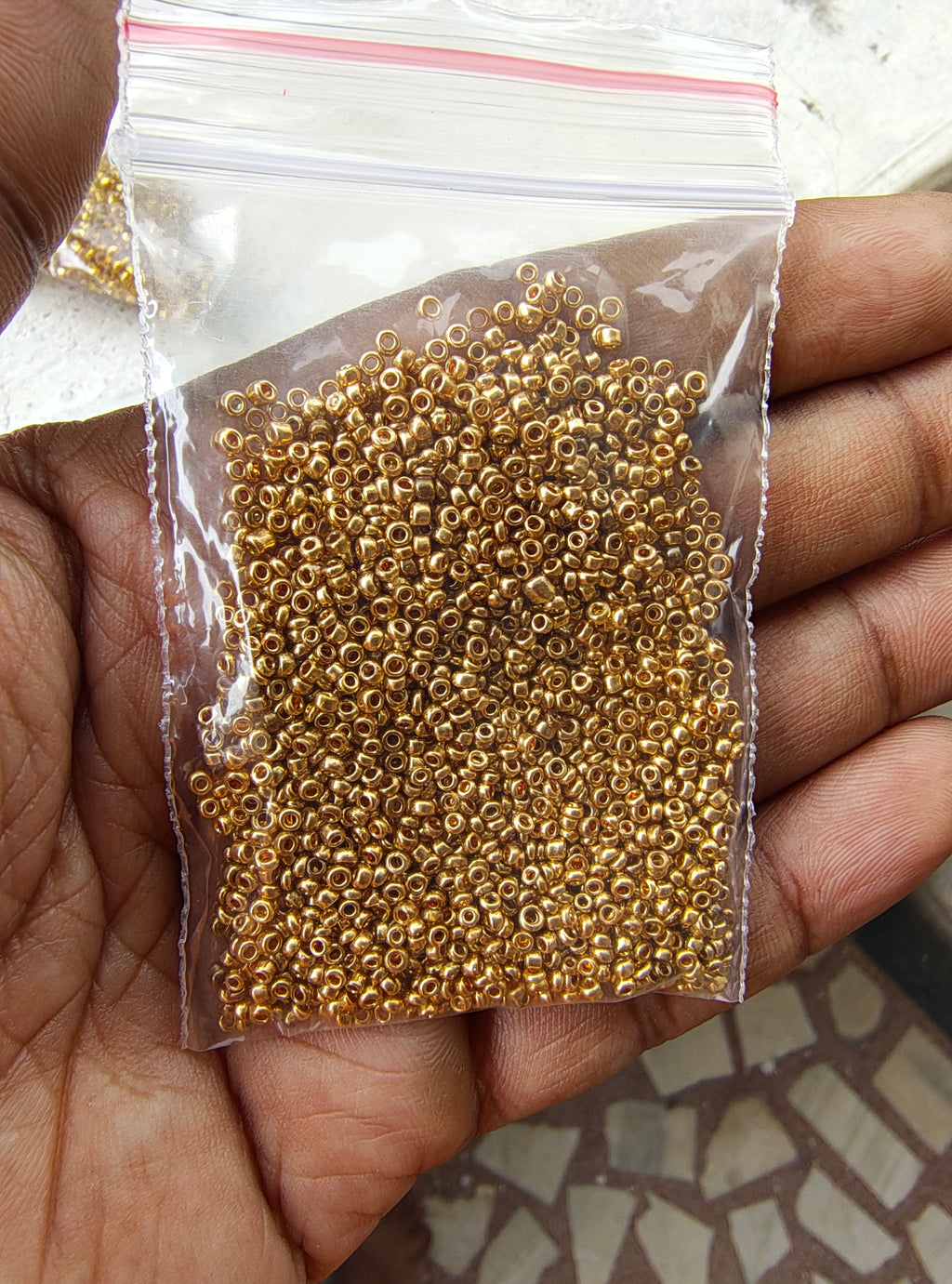 Small golden seed beads