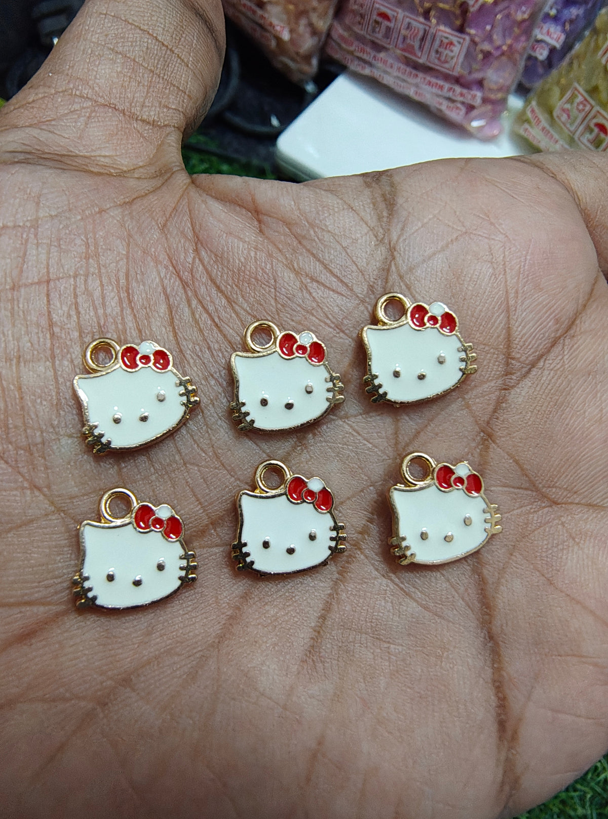 Kitty charm with red bow ( EC1015 )