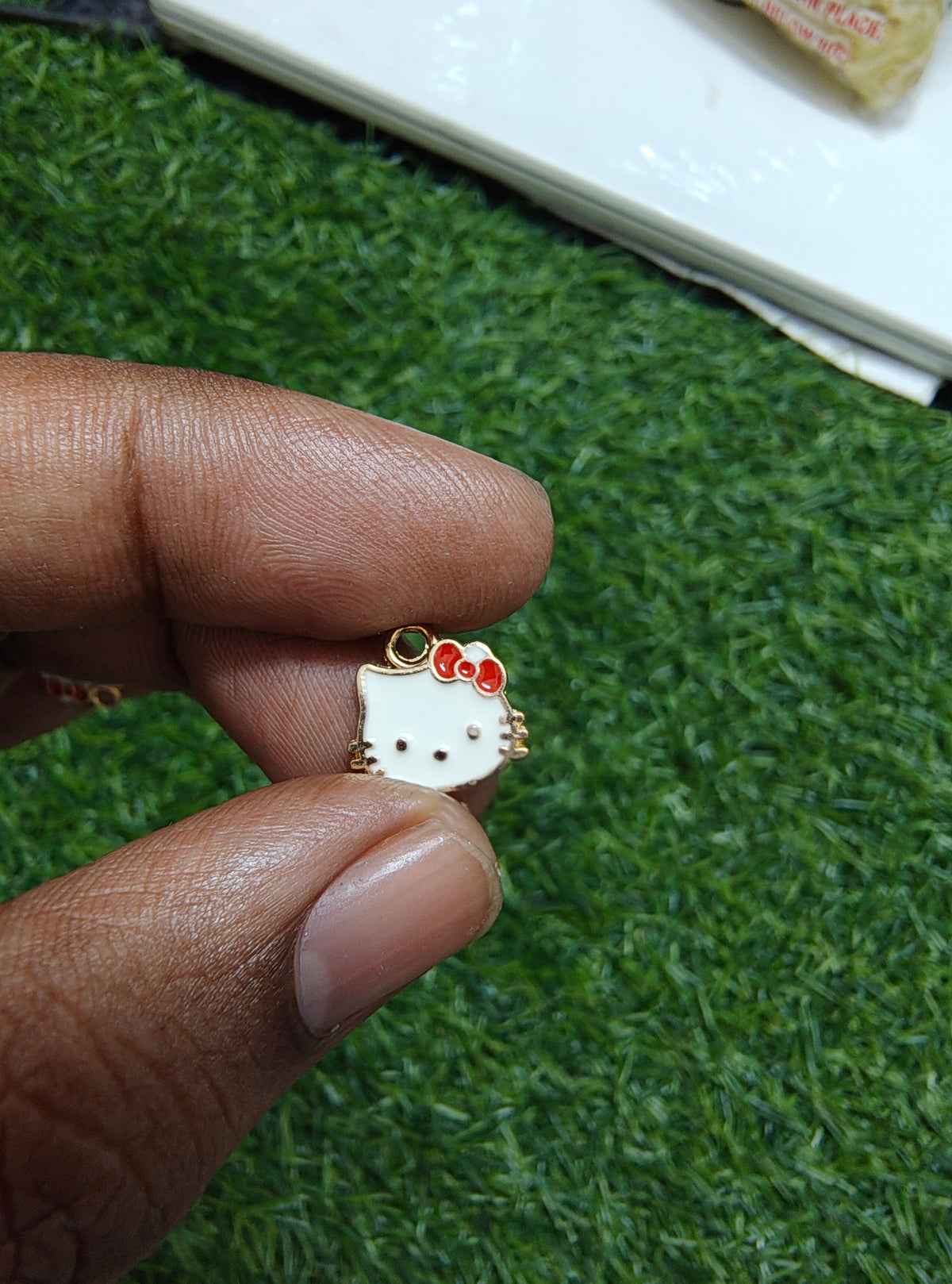 Kitty charm with red bow ( EC1015 )