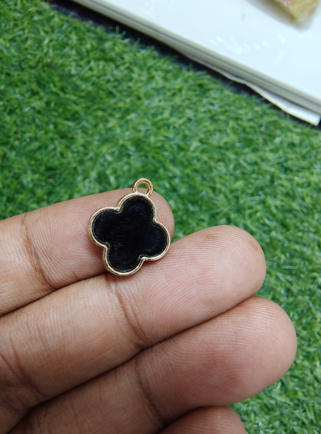 Quatrefoil charm