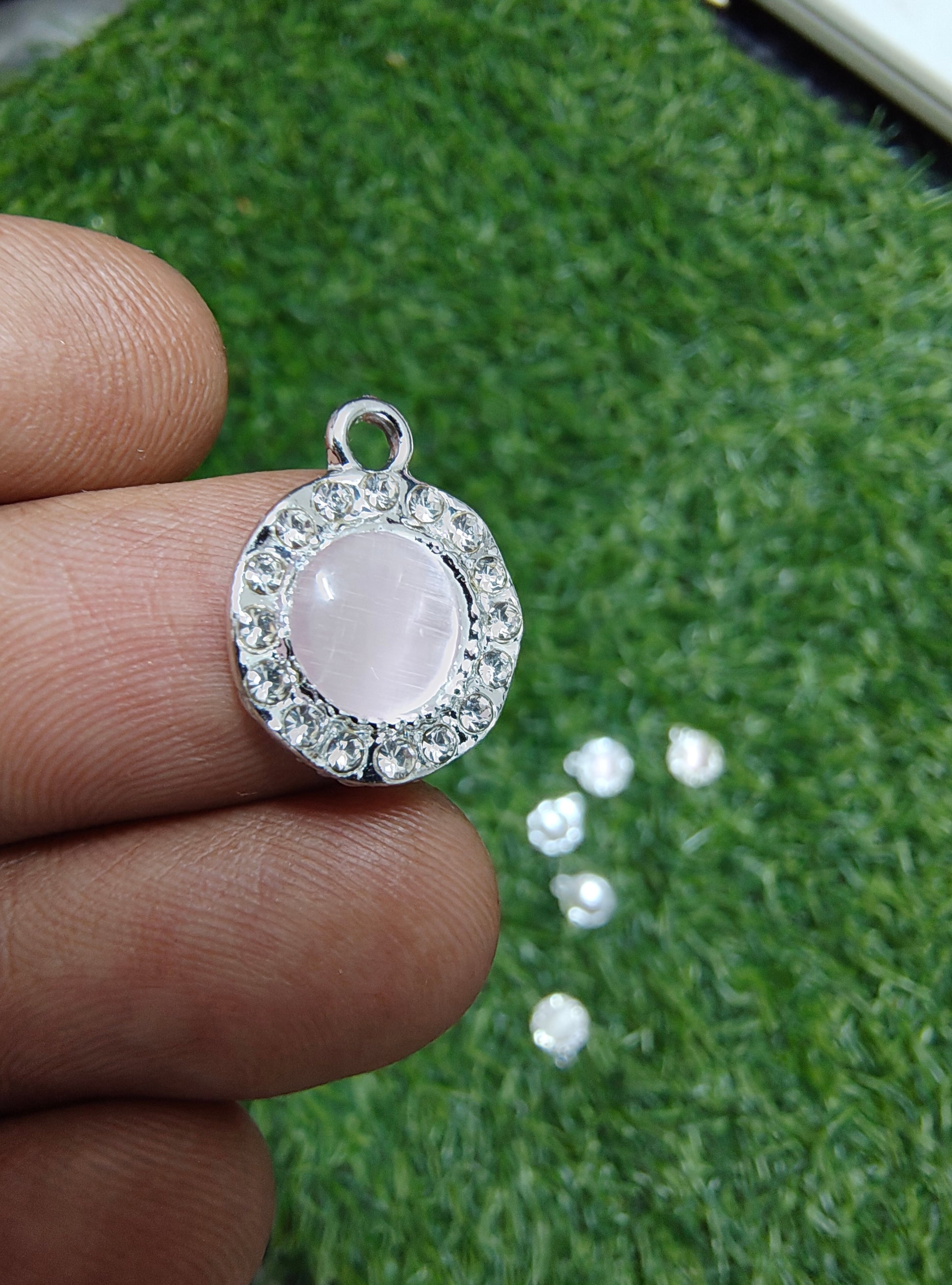 Round pink/white stone charm