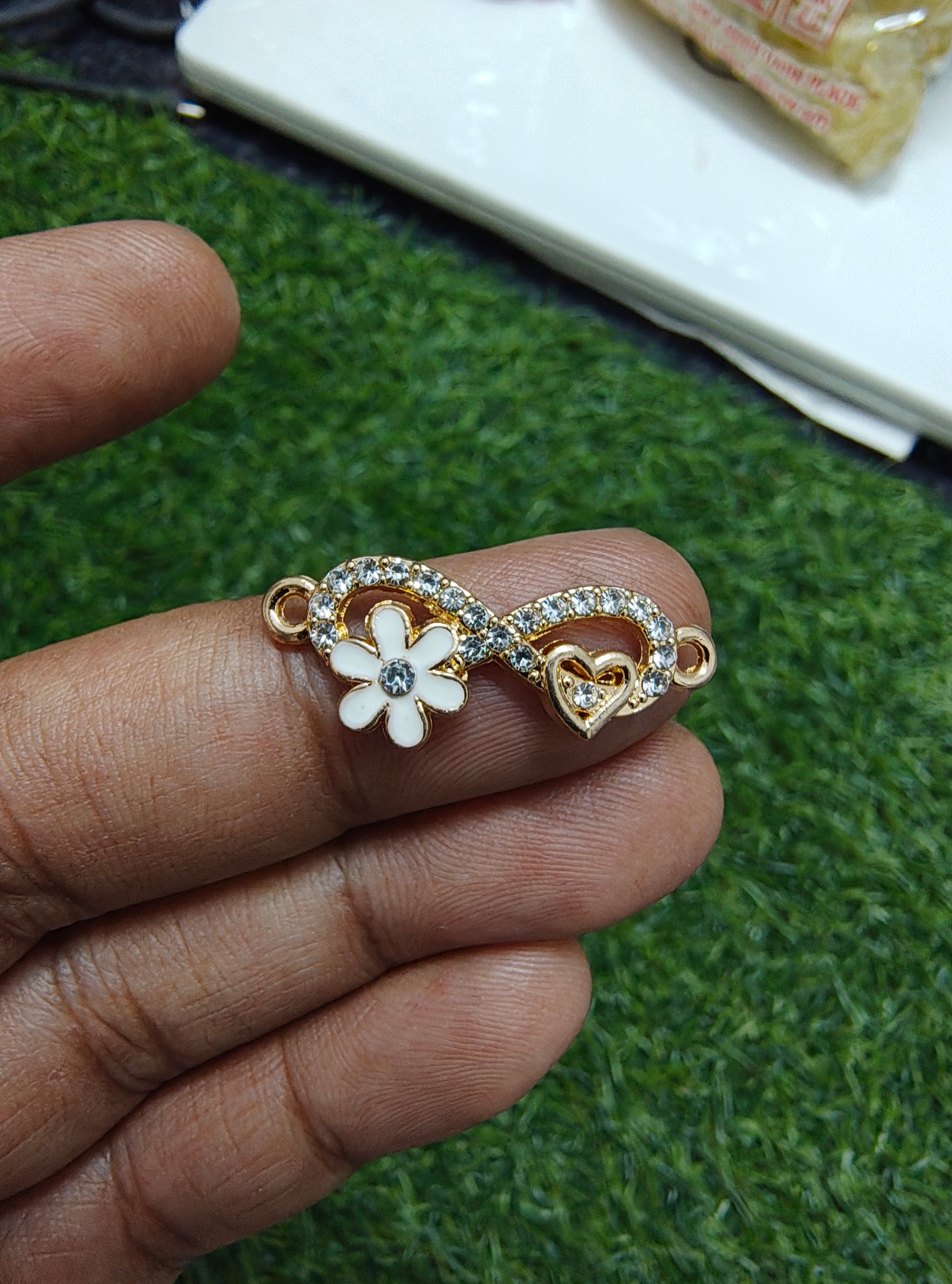 Infinity stone charm with flower