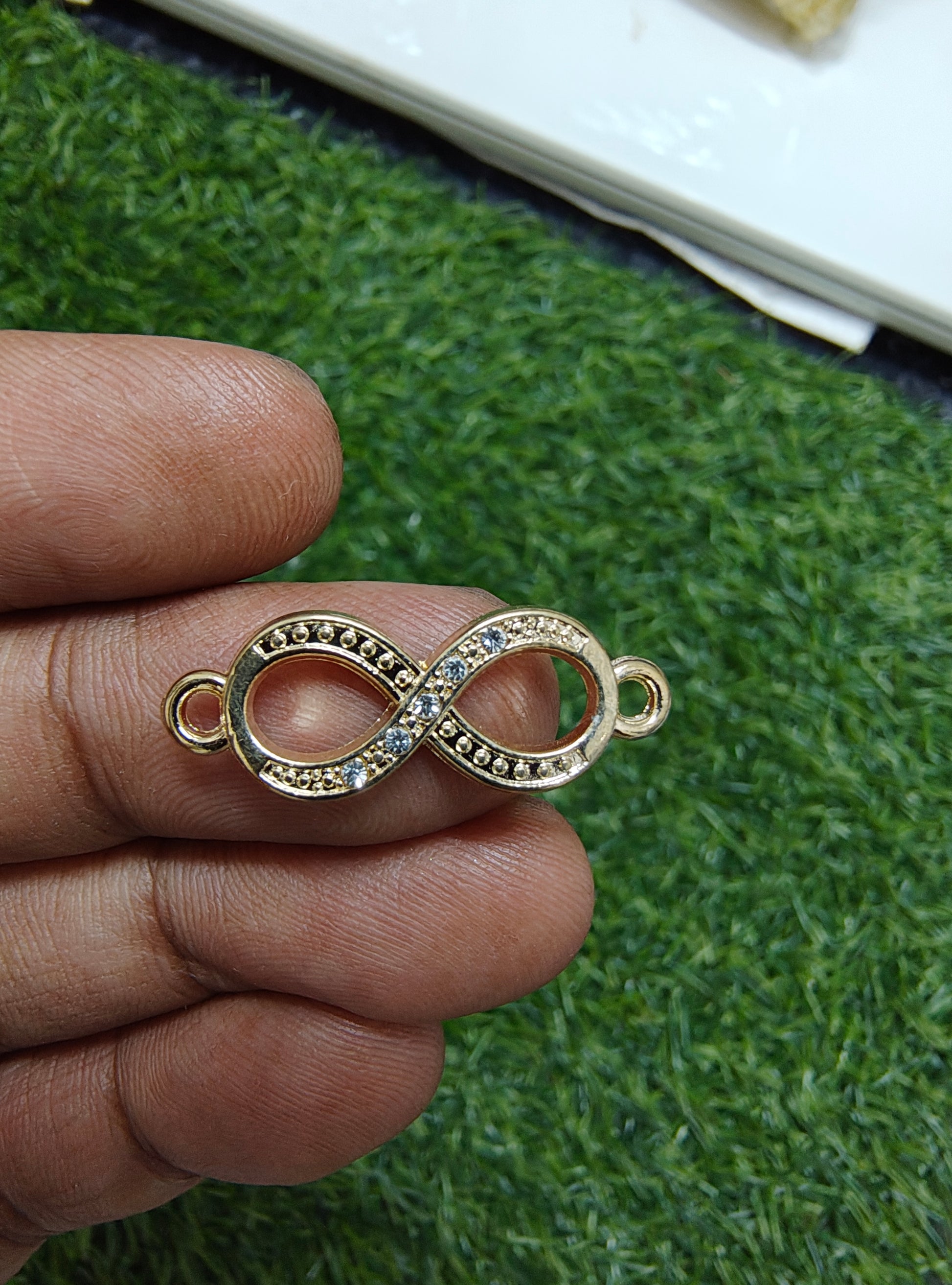 Infinity stone charm with flower