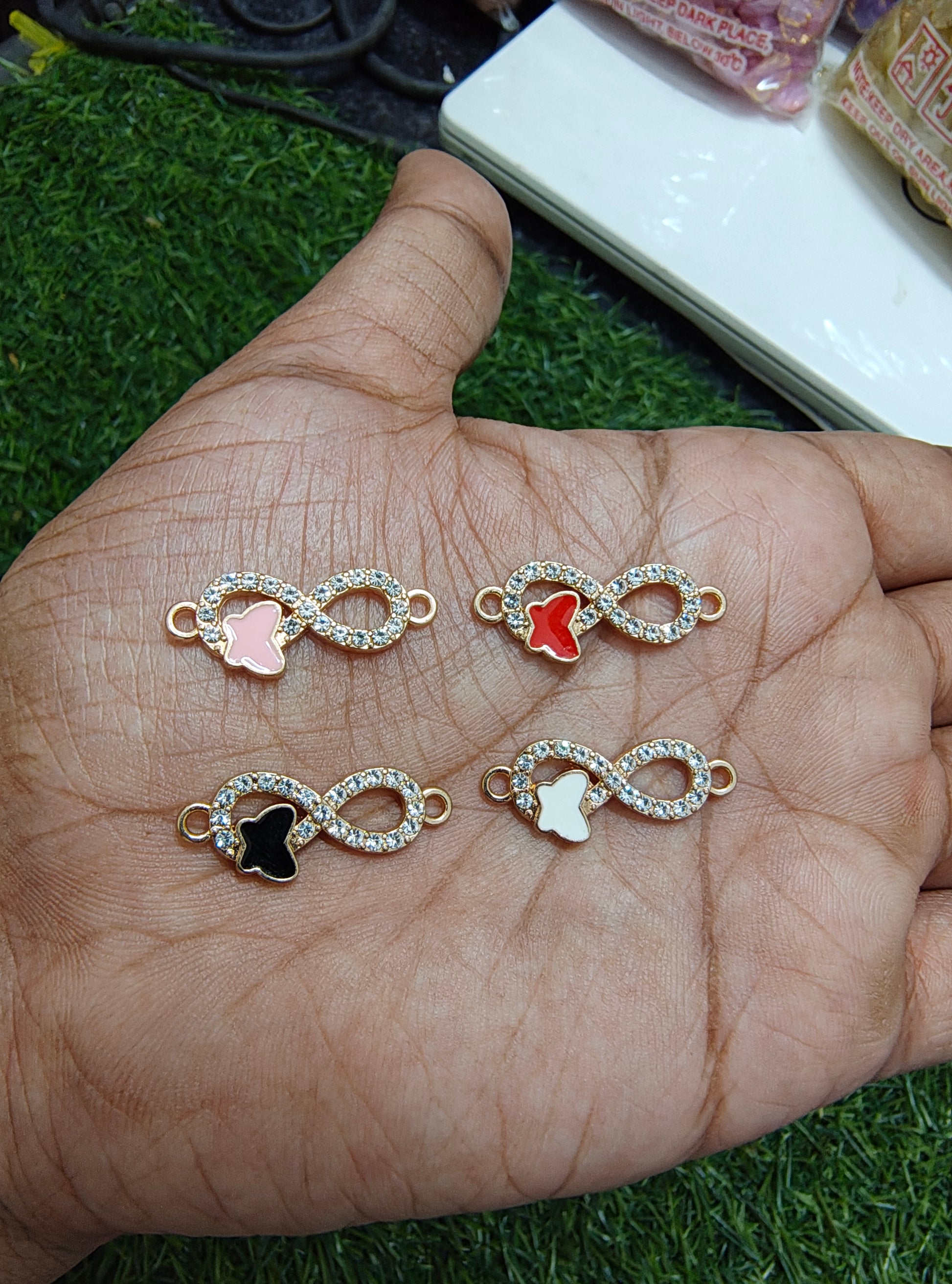 Stone infinity charm with butterfly