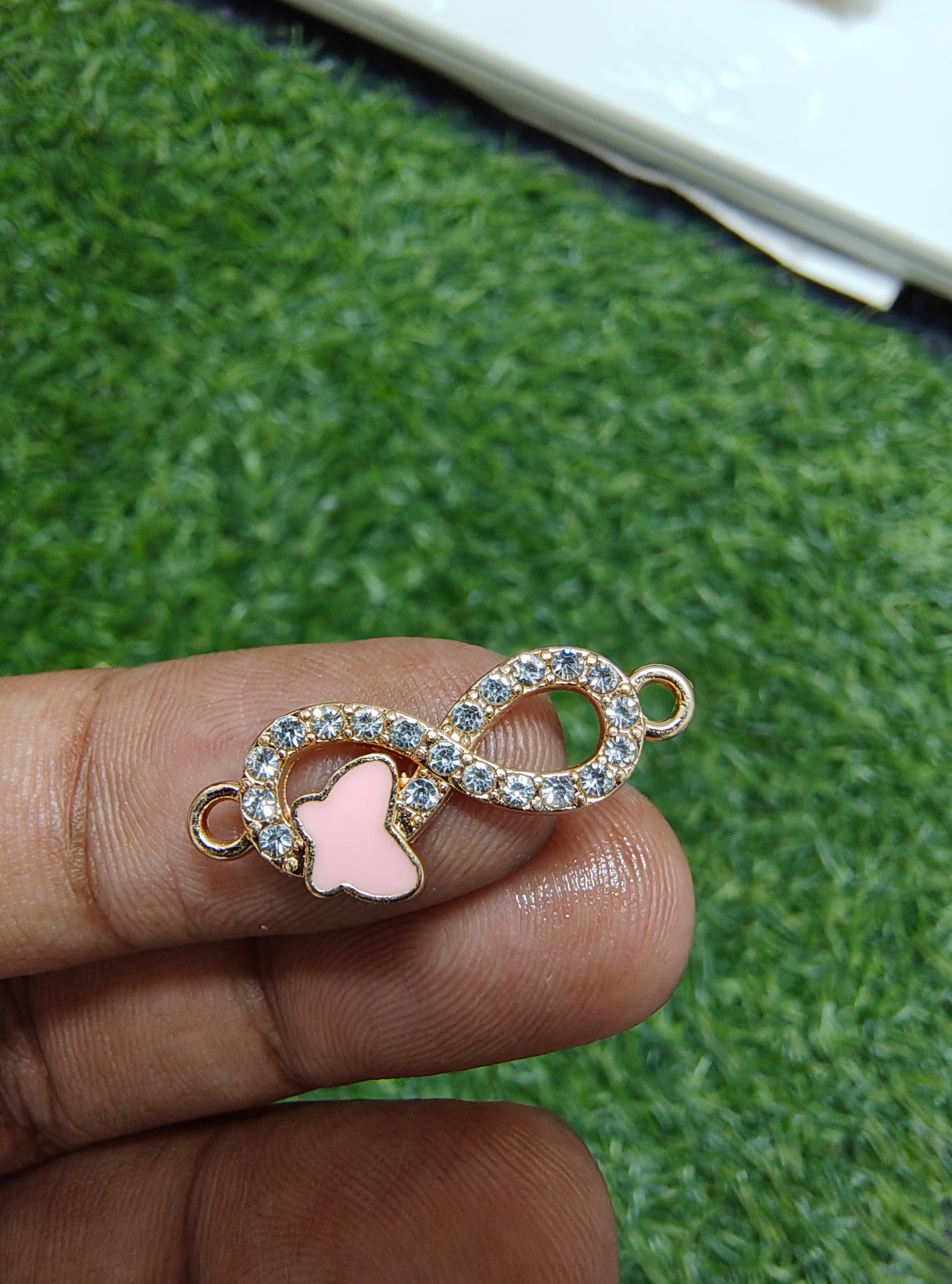 Stone infinity charm with butterfly