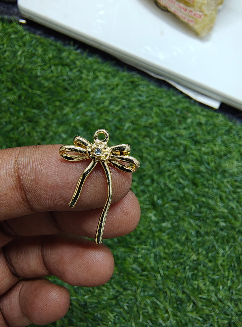 Premium quality golden bow charm with stone