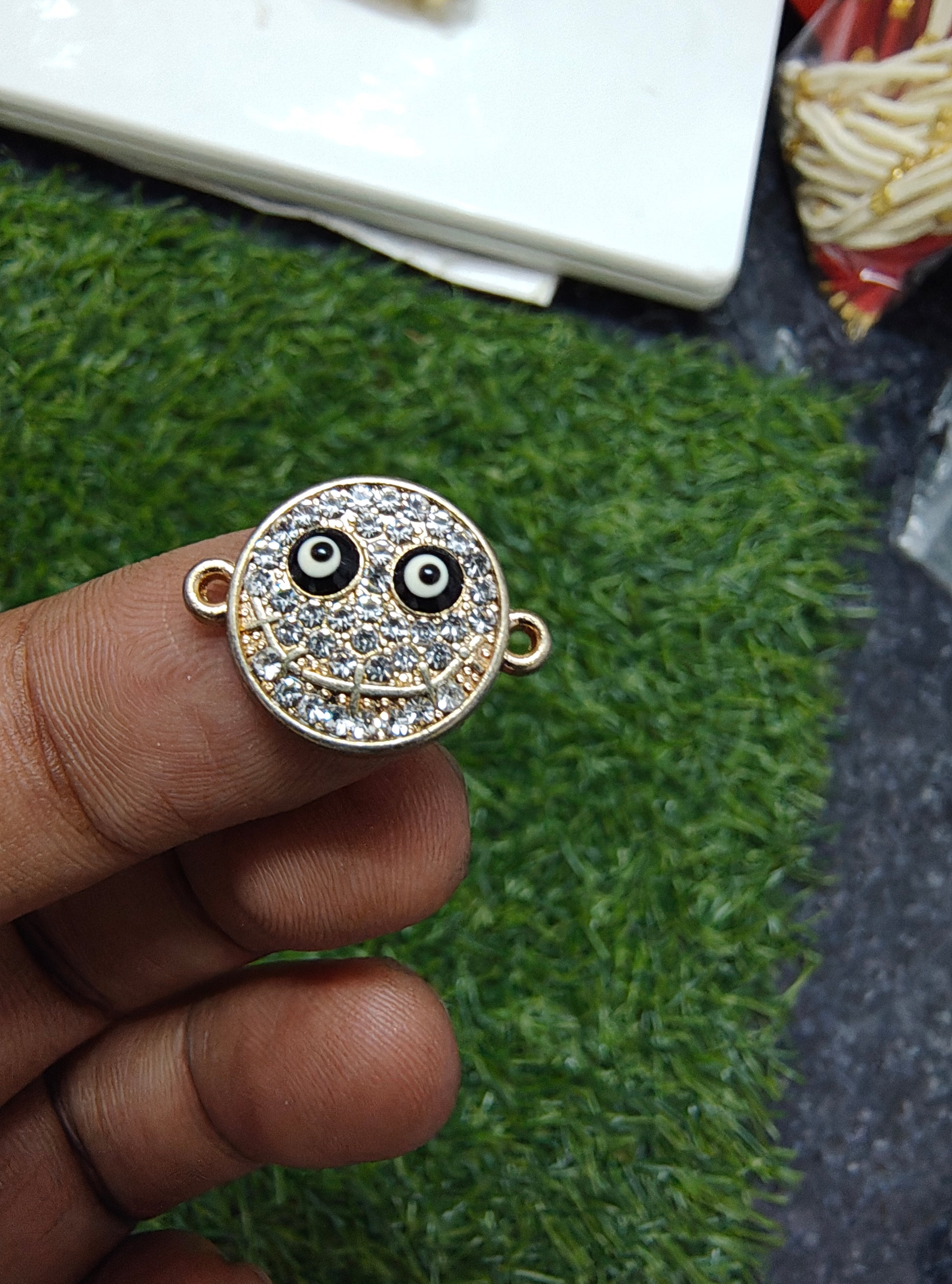 Stone face charm