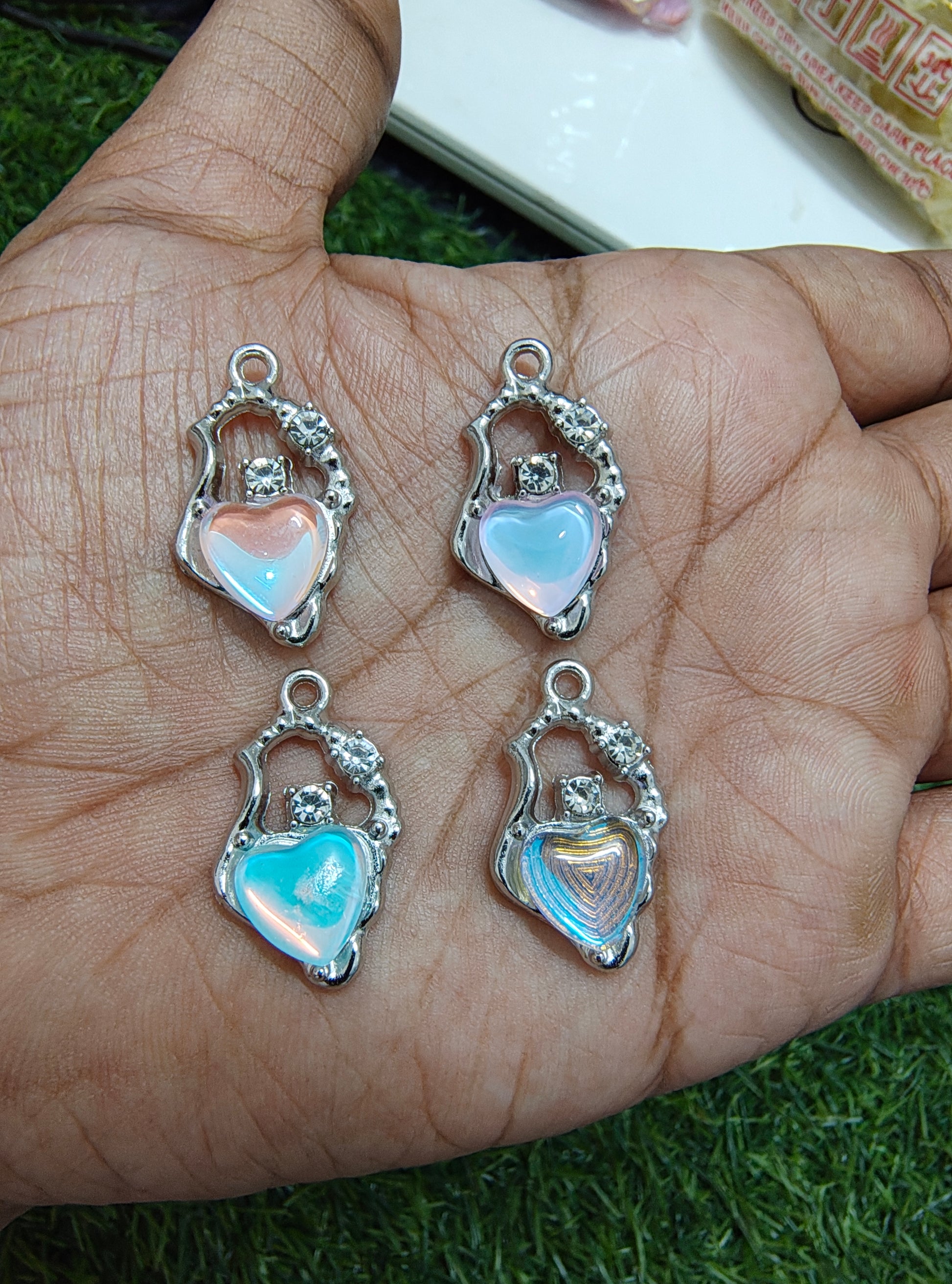 Stone charm with heart of different colour