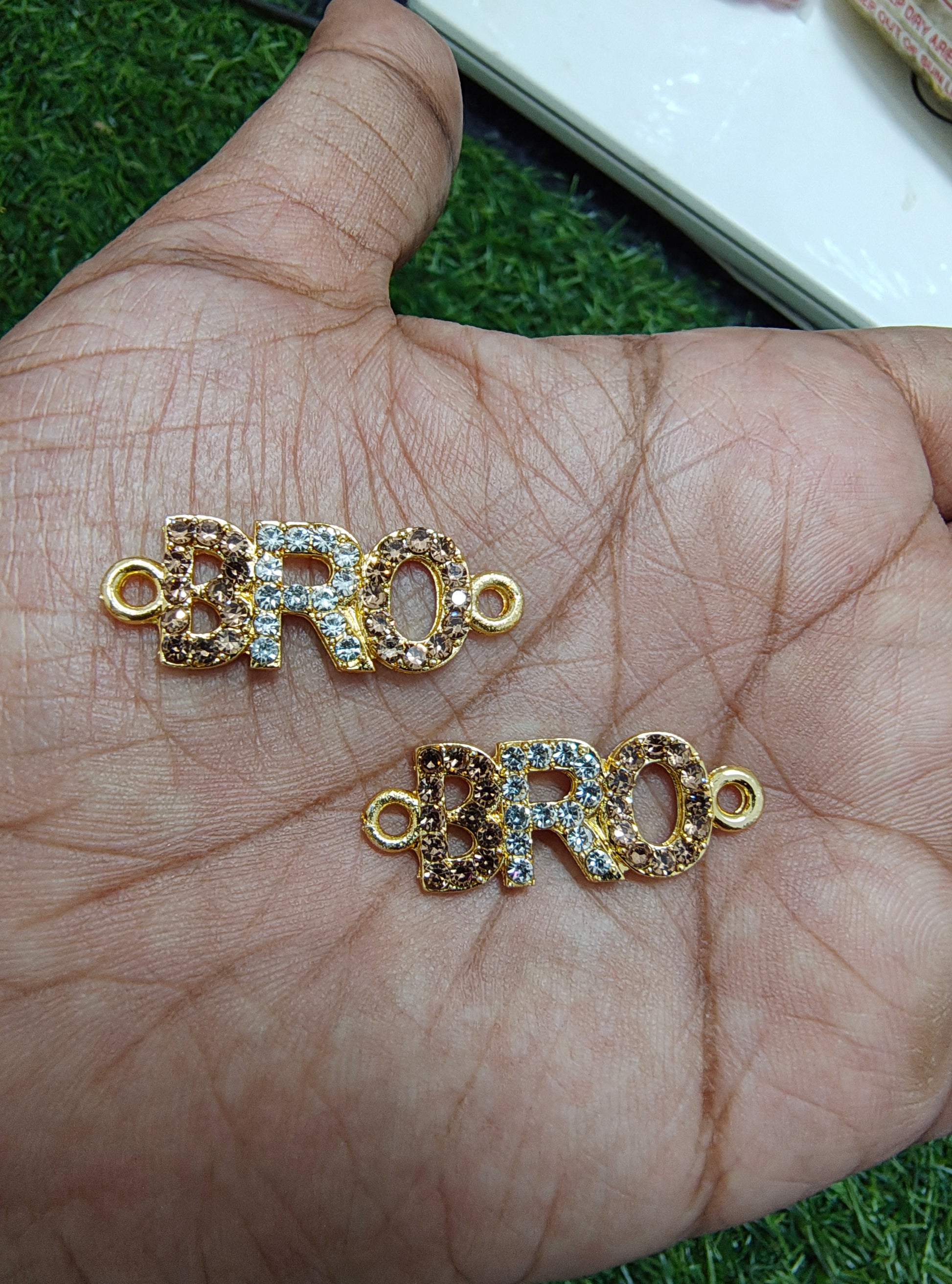 BRO stone rakhi charm