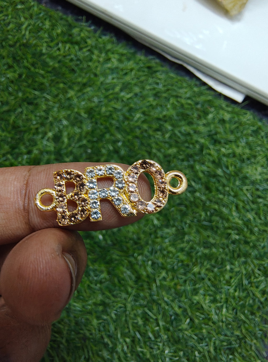 BRO stone rakhi charm