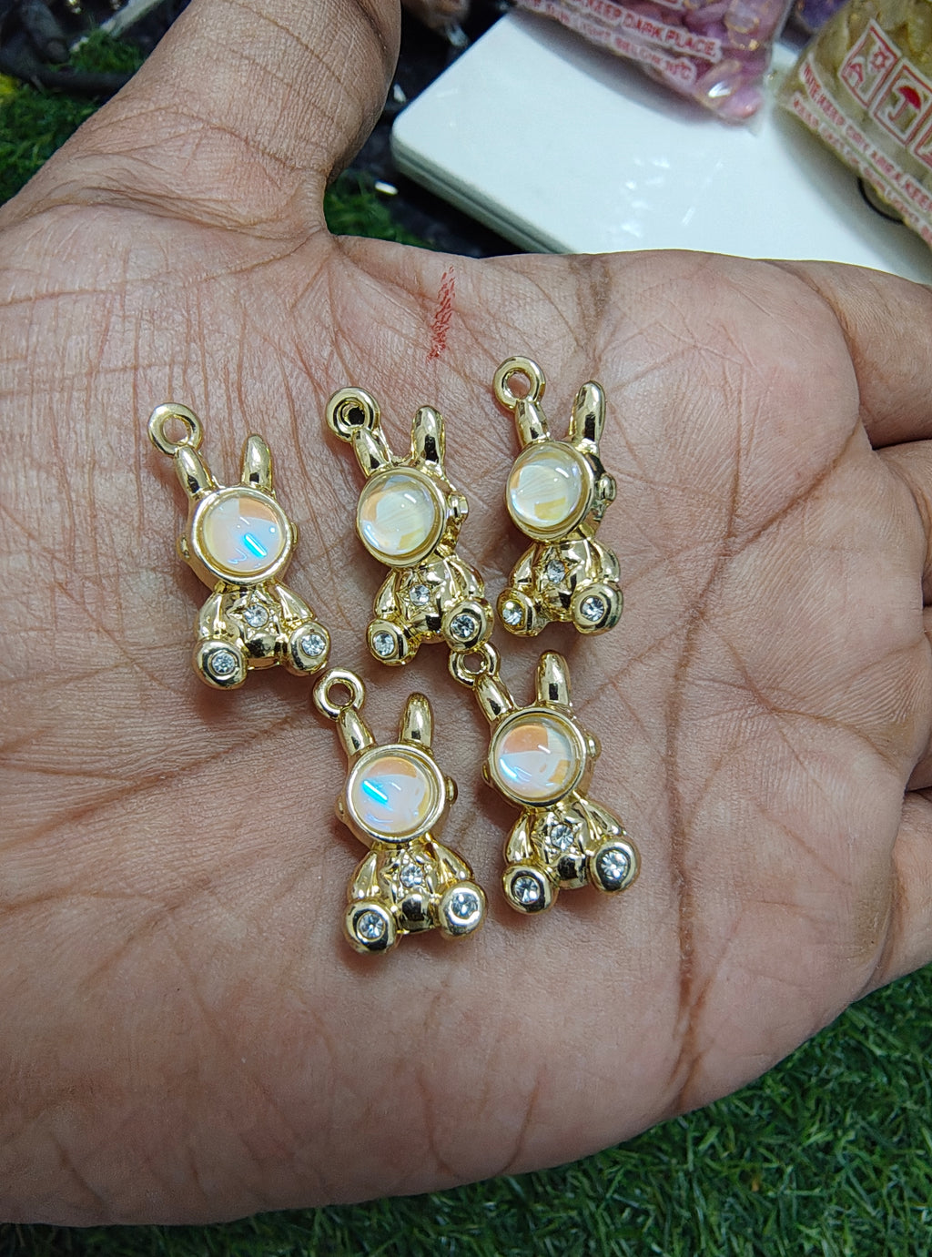 Robot with stone charm