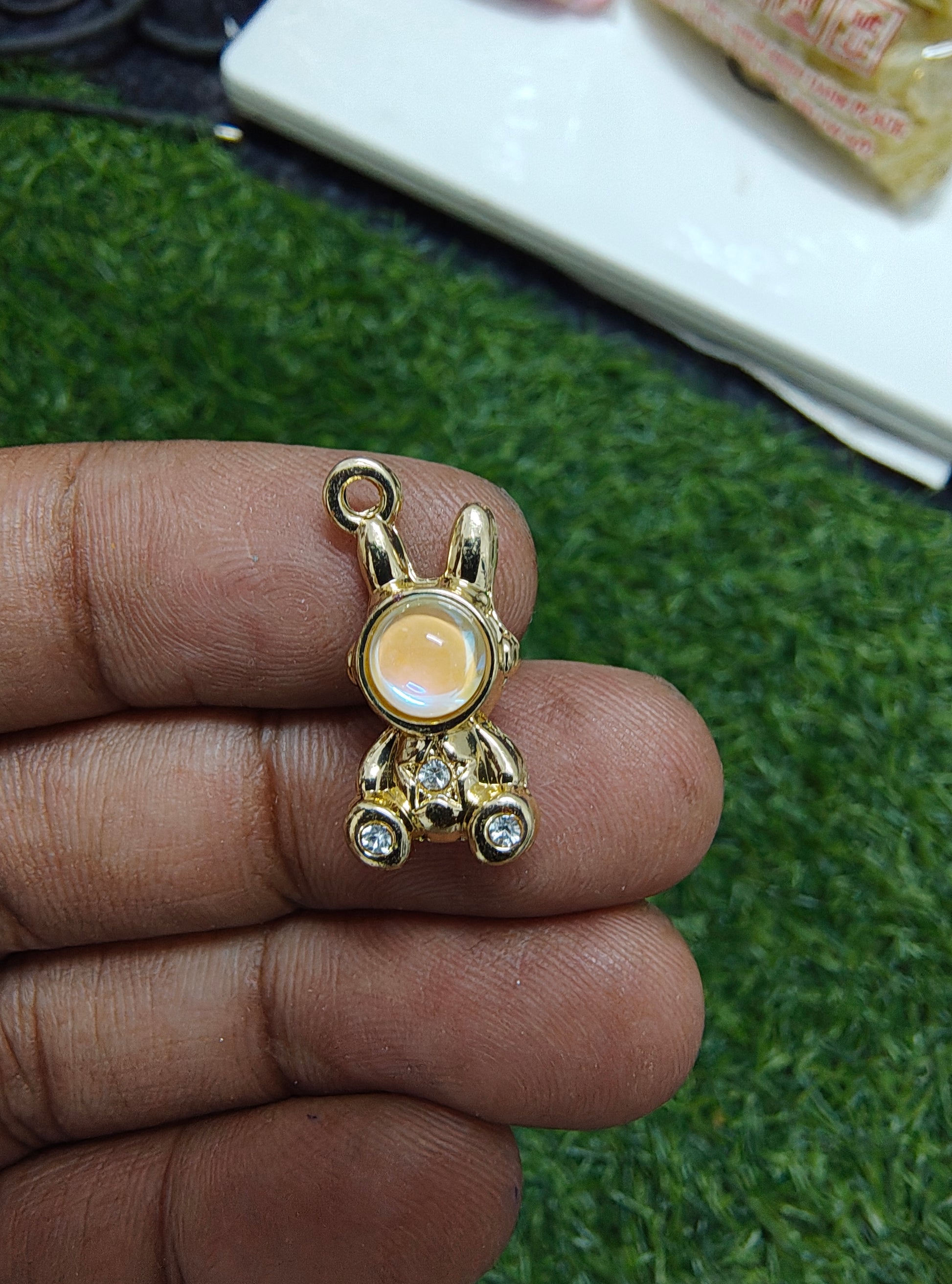 Robot with stone charm