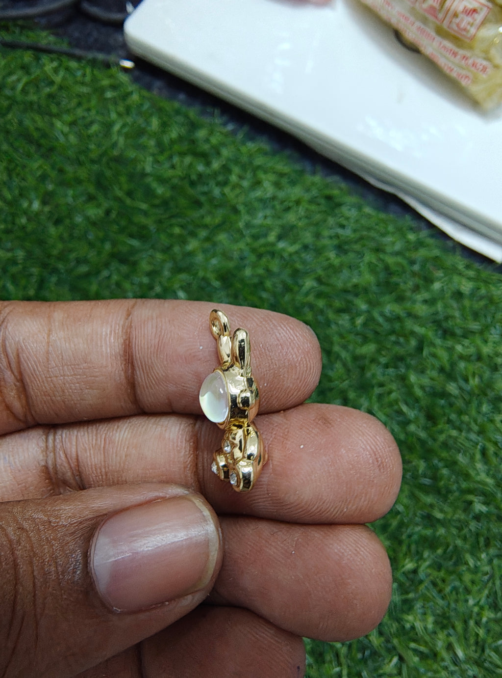 Robot with stone charm