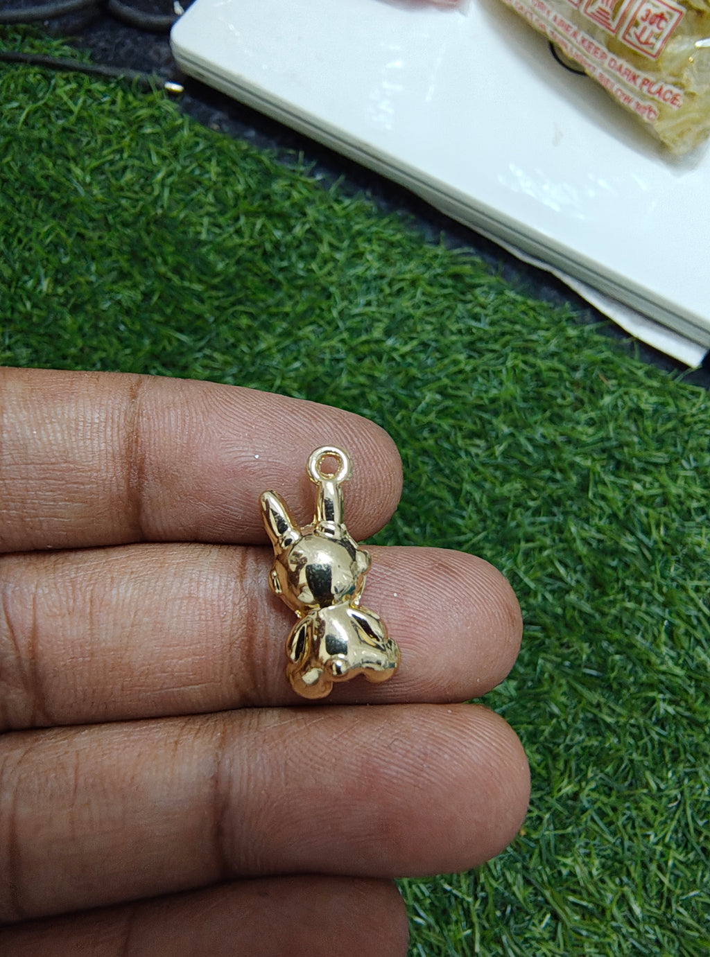 Robot with stone charm