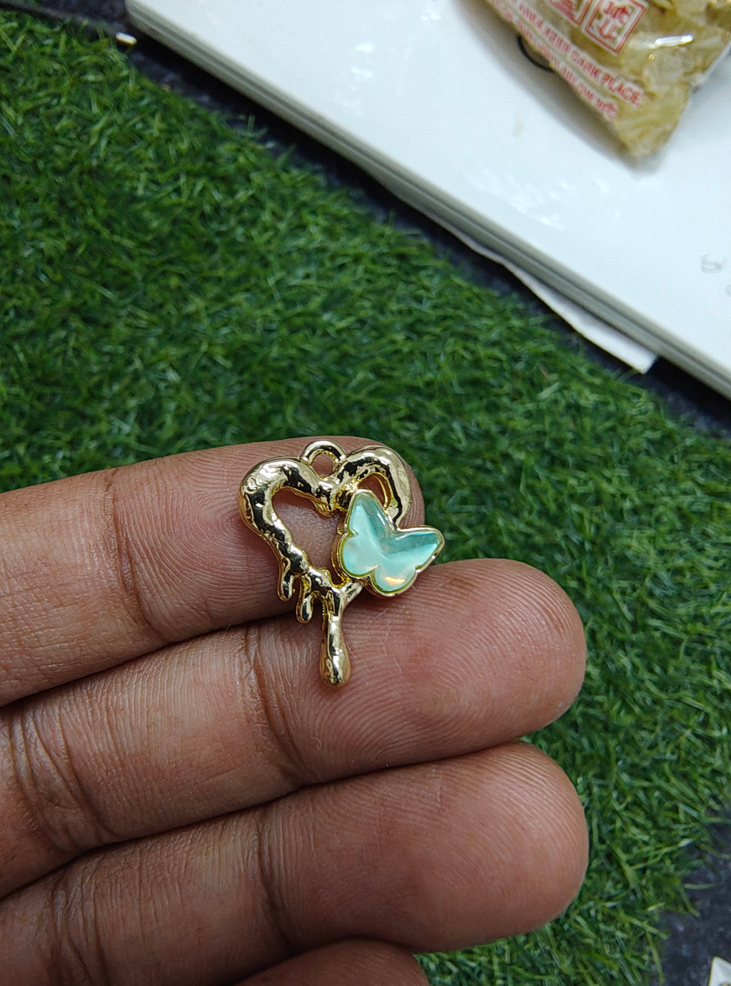 Stone butterfly with heart charm