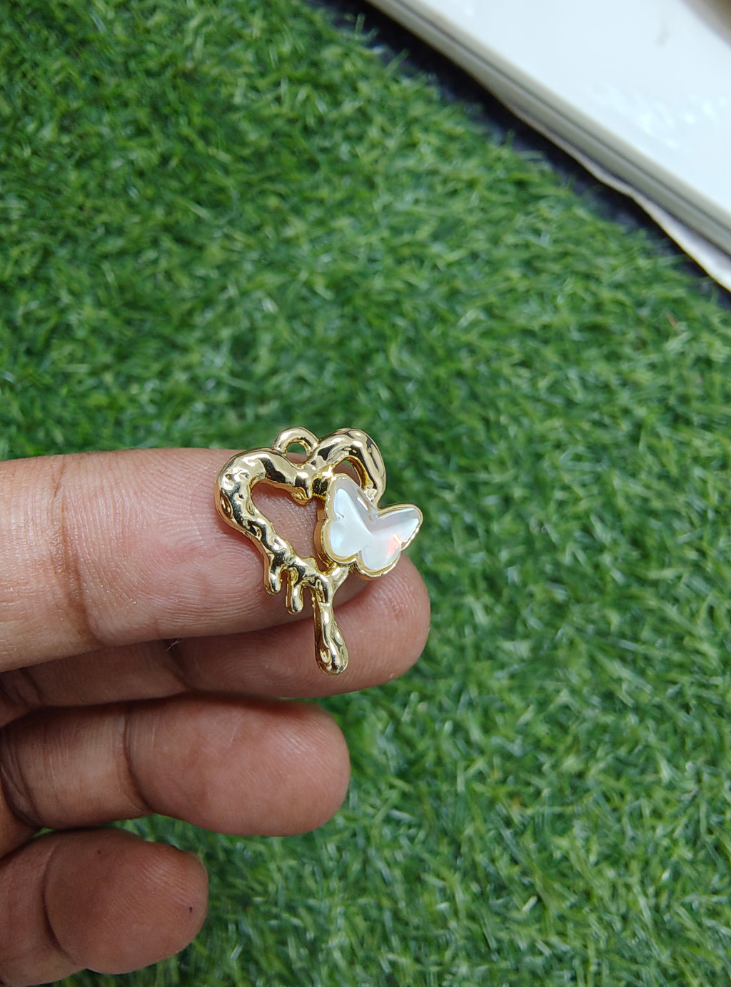 Stone butterfly with heart charm