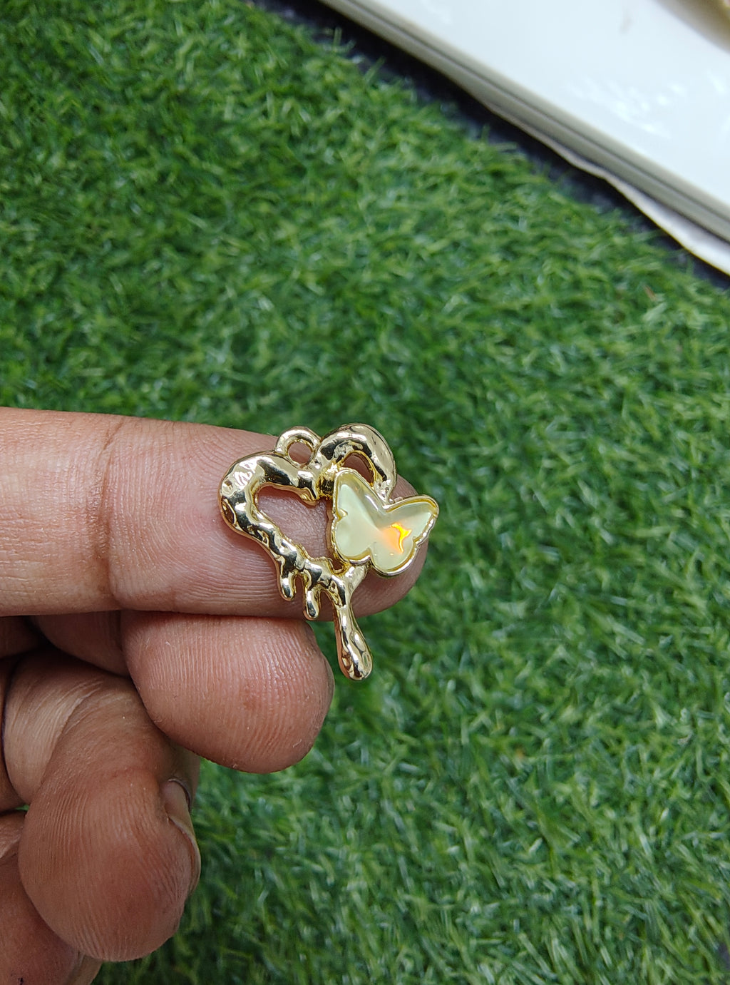 Stone butterfly with heart charm