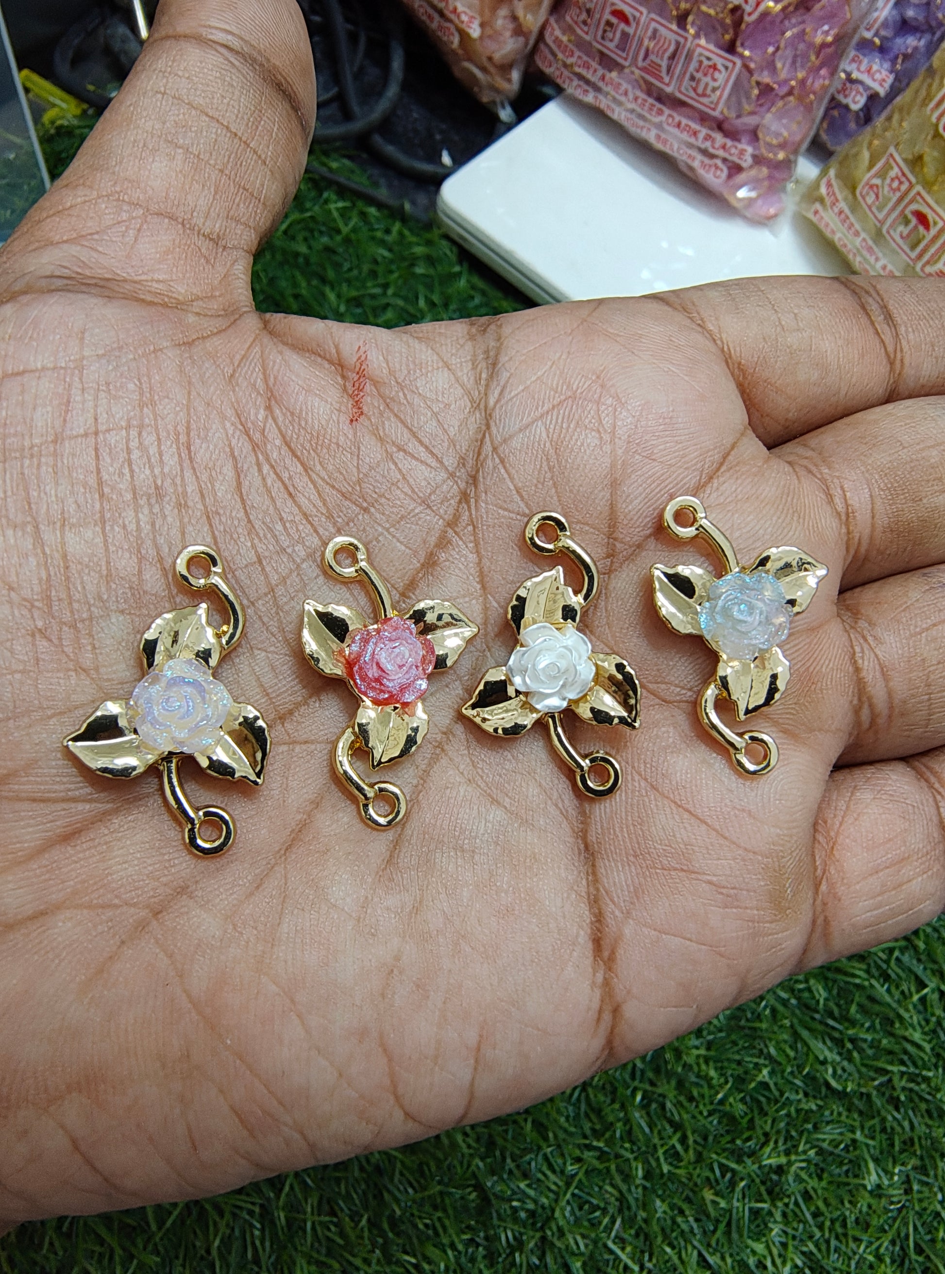 Rose in metal rakhi charm