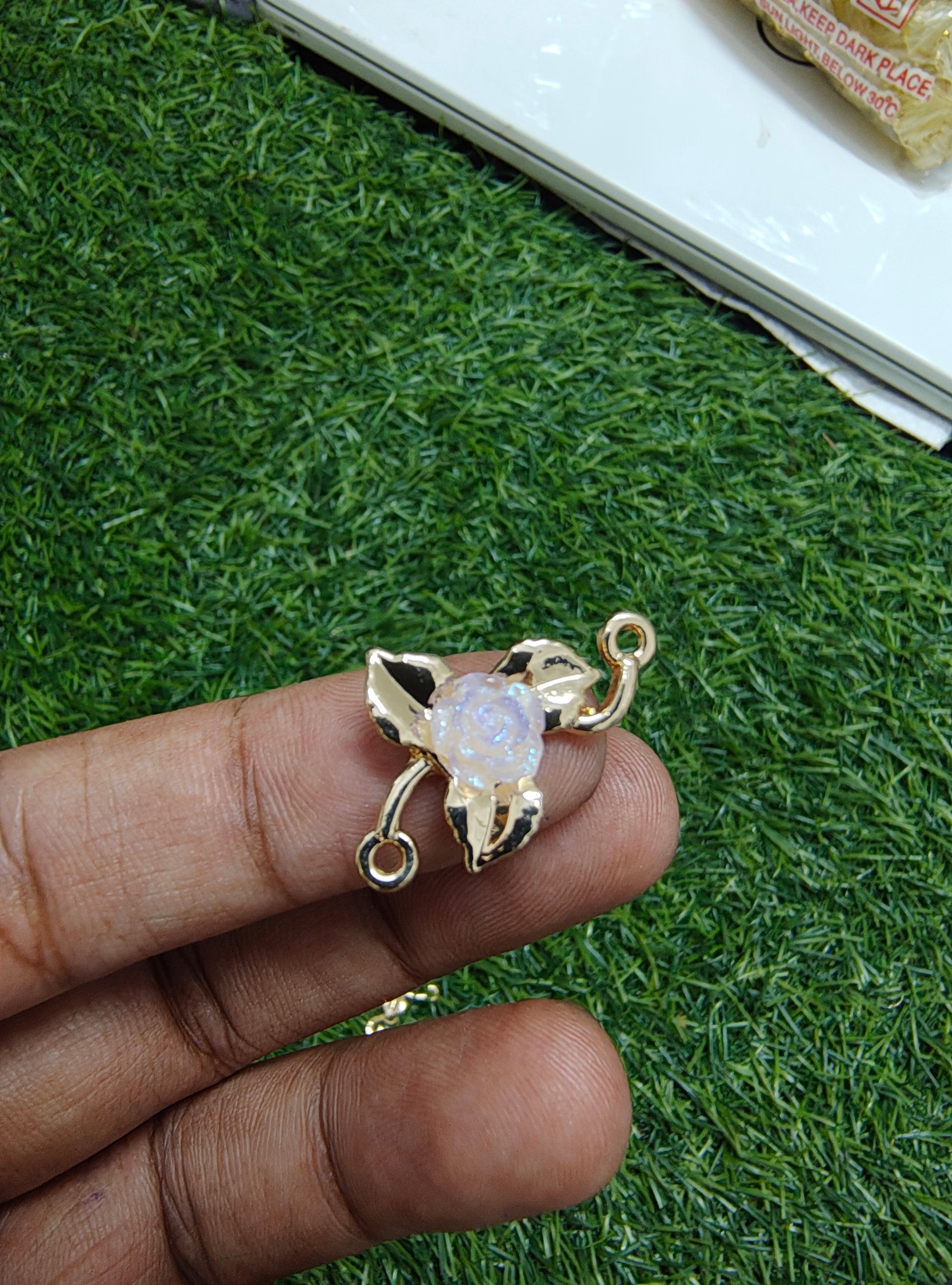 Rose in metal rakhi charm