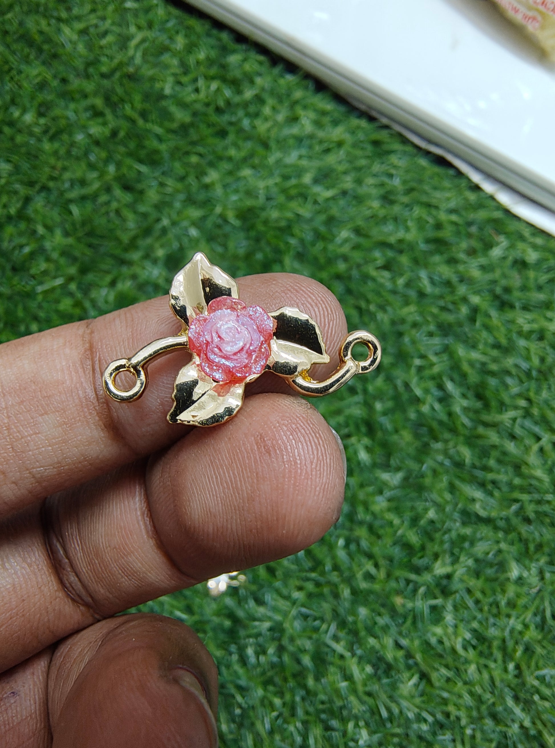 Rose in metal rakhi charm