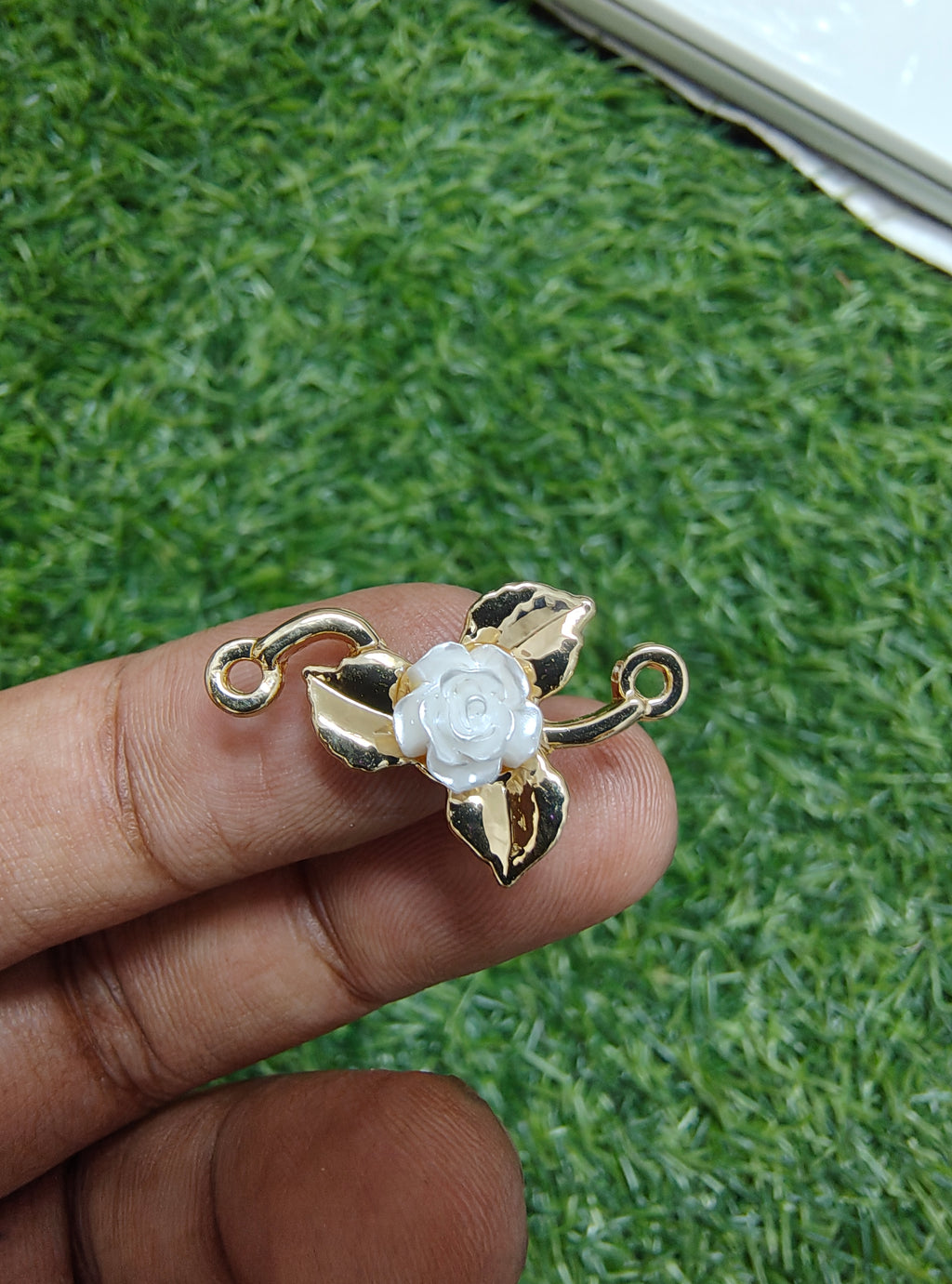 Rose in metal rakhi charm