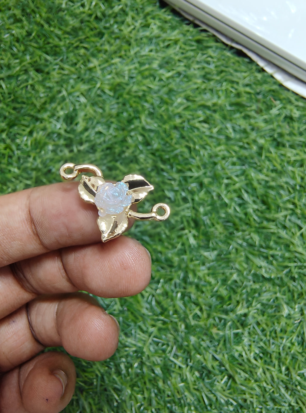 Rose in metal rakhi charm