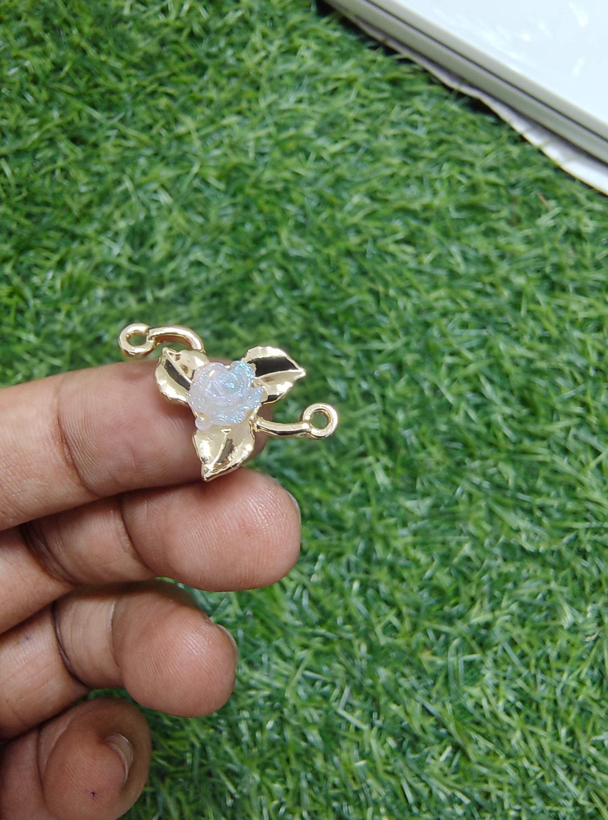 Rose in metal rakhi charm