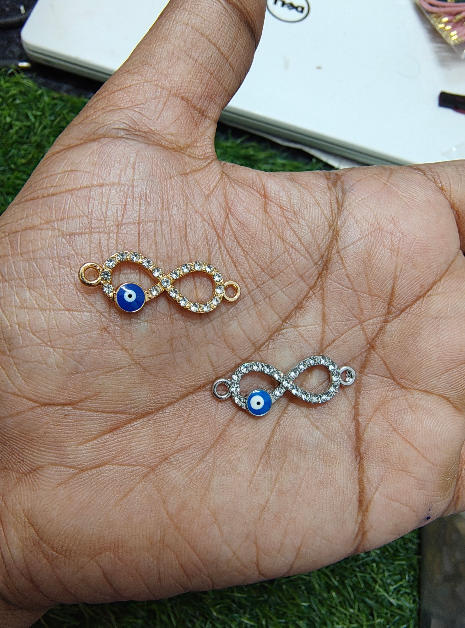Infinity stone charm with evil eye