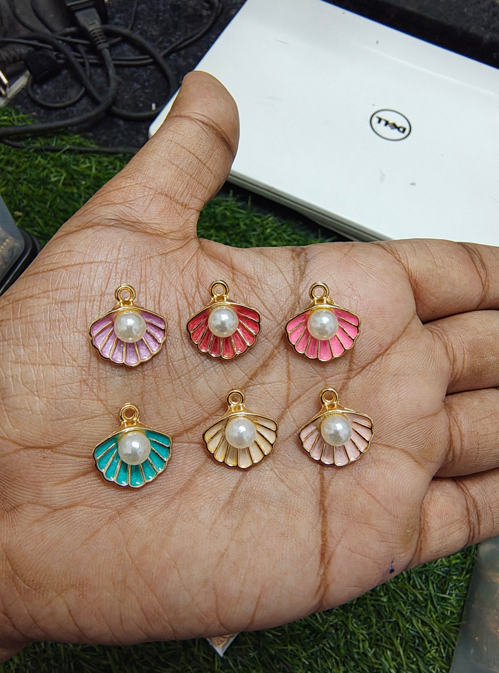 Shell charm with pearl