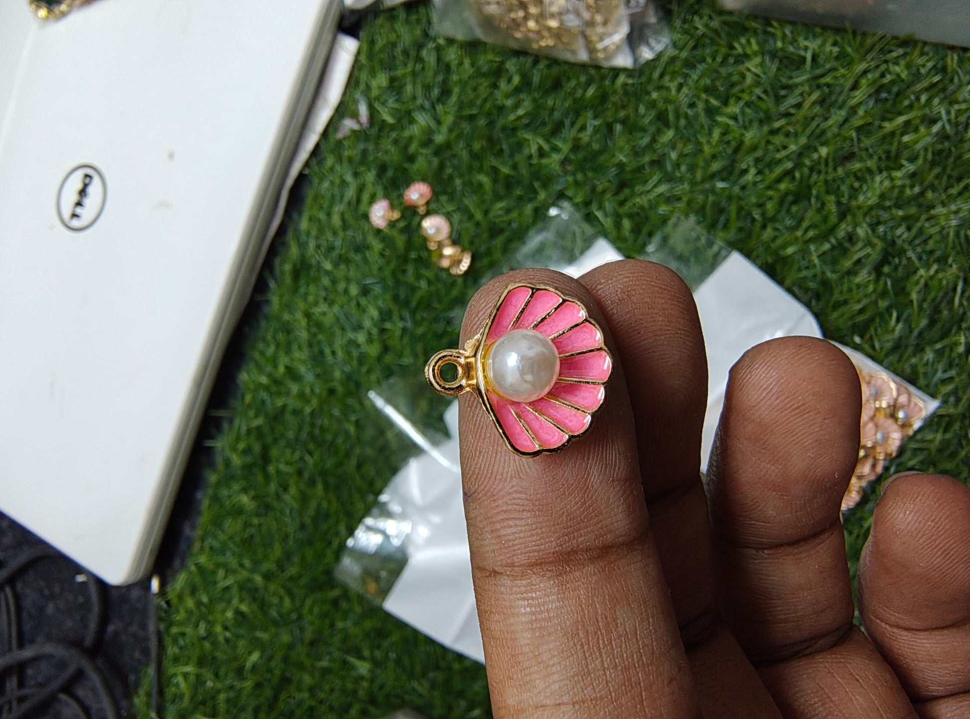 Shell charm with pearl