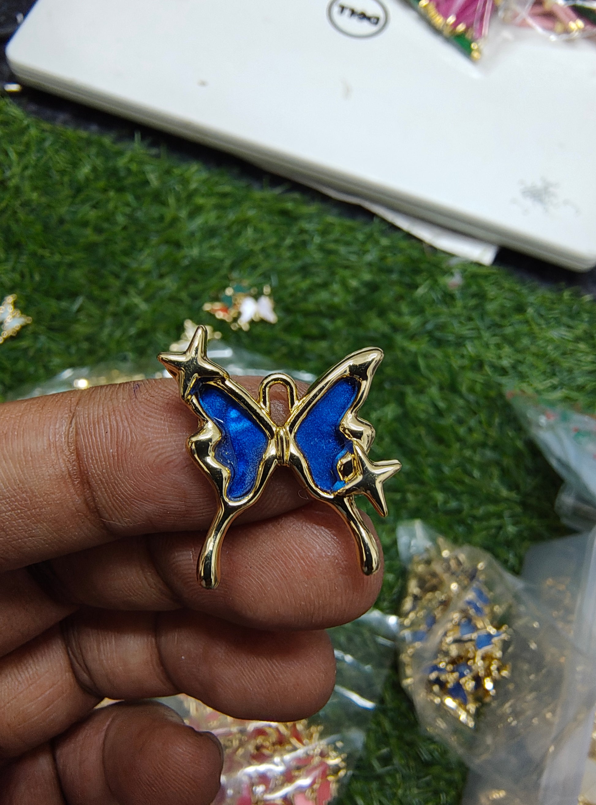 Antiturnish butterfly charm