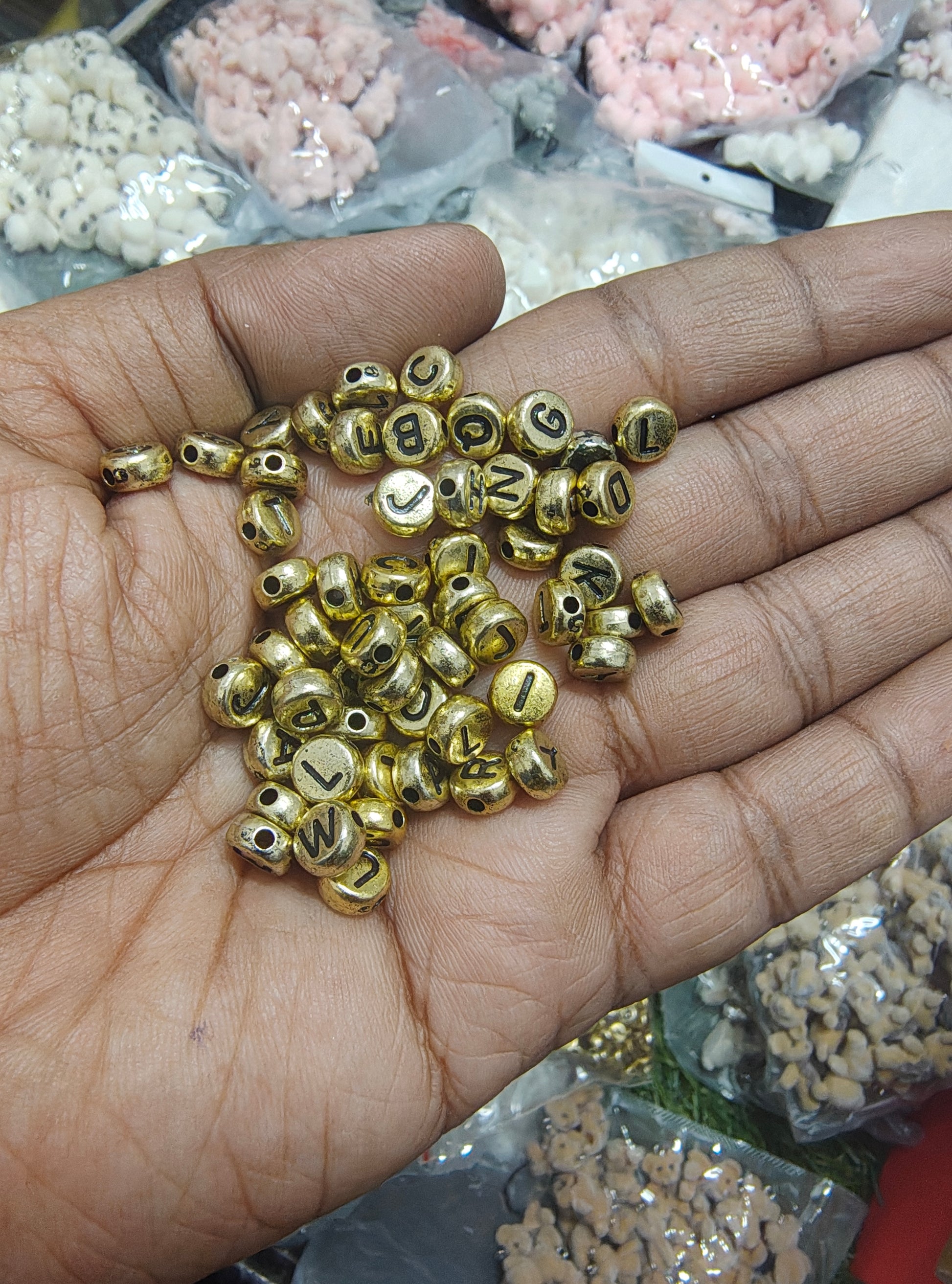 Golden round alphabet beads