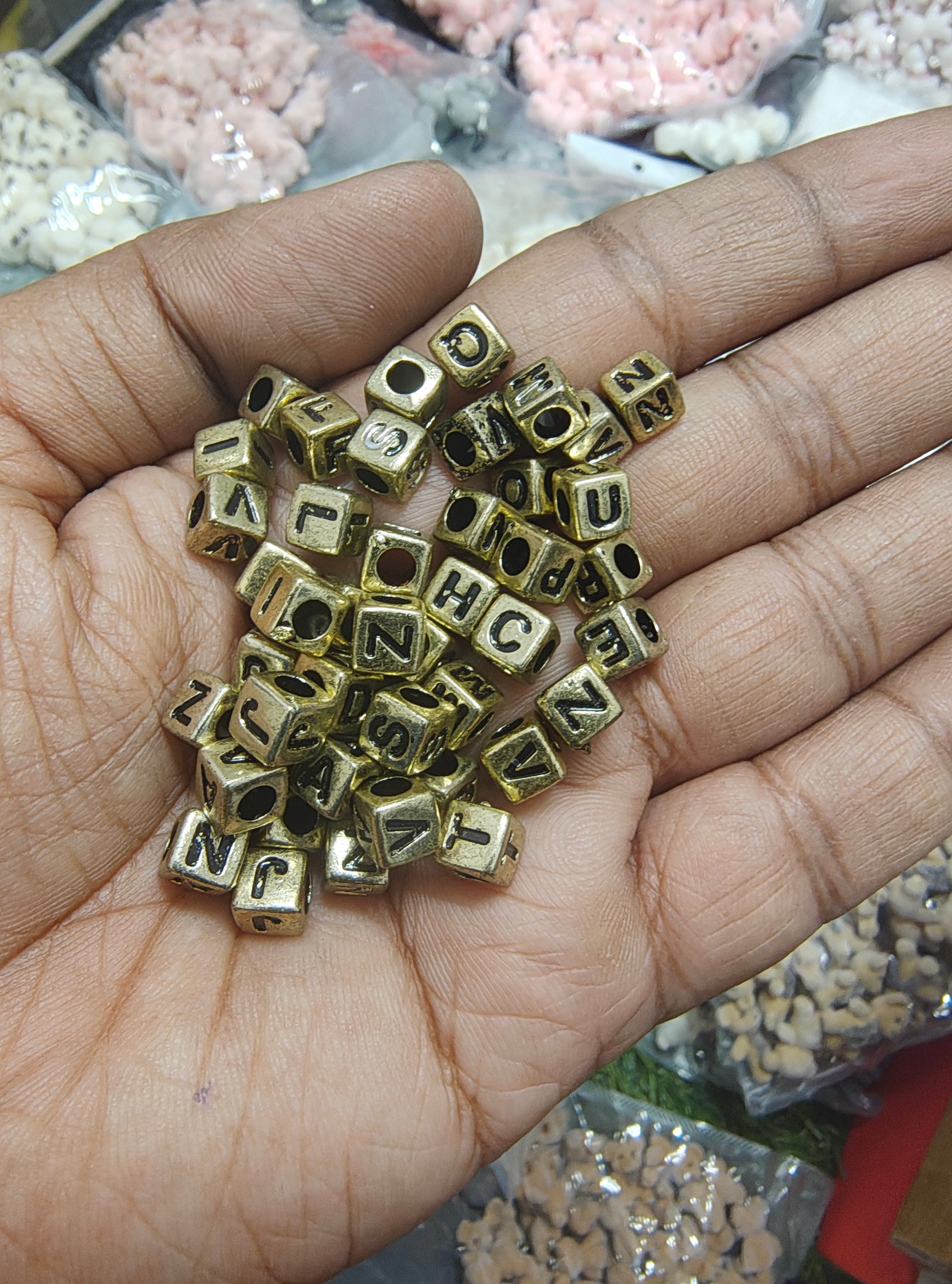 Golden square alphabet beads