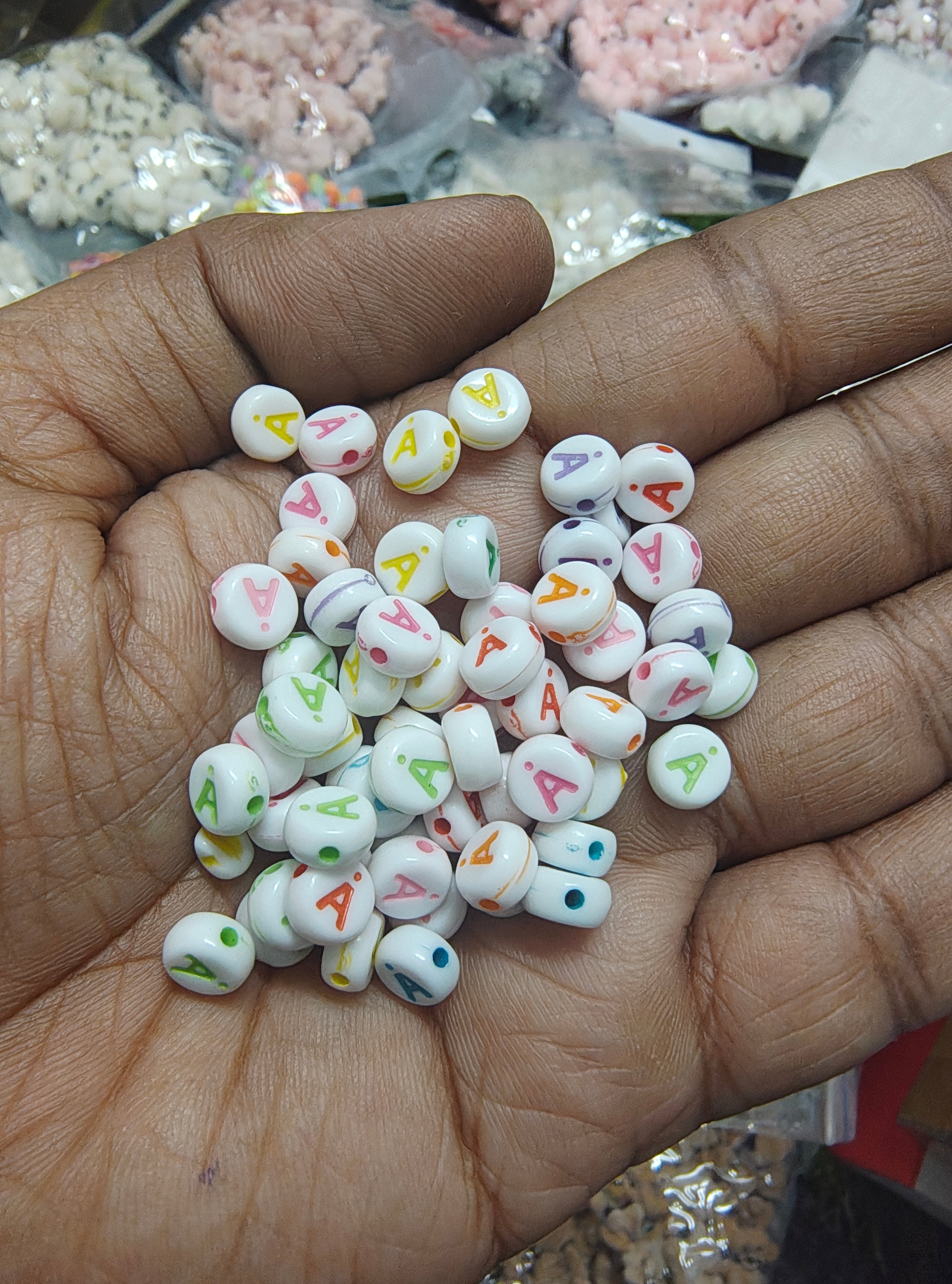 Round multicolour "A" letter beads