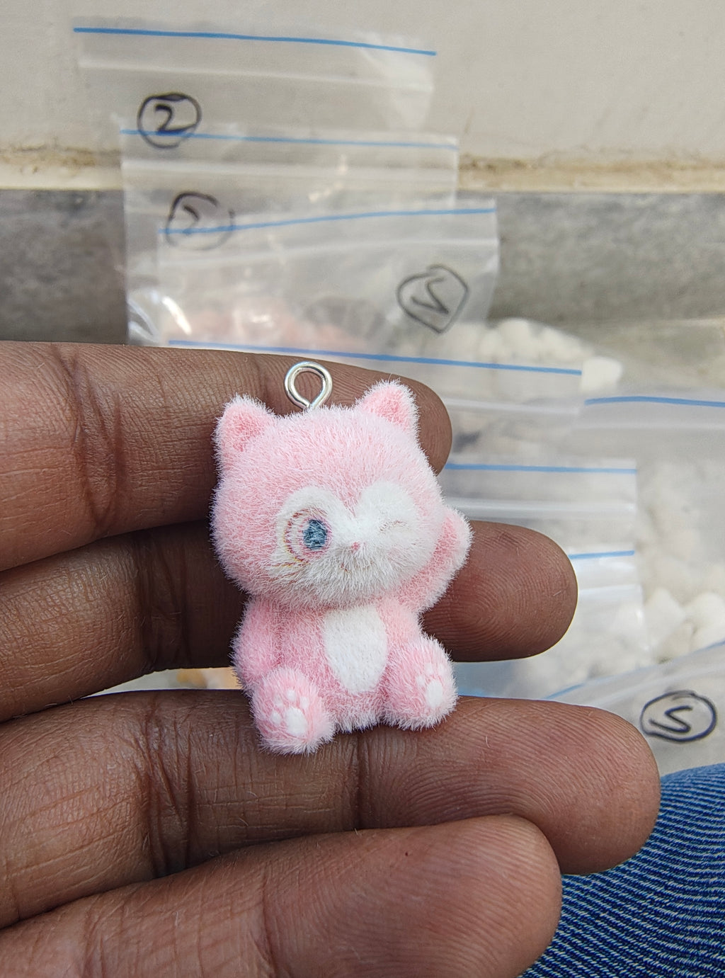 Light pink snitch fur charm