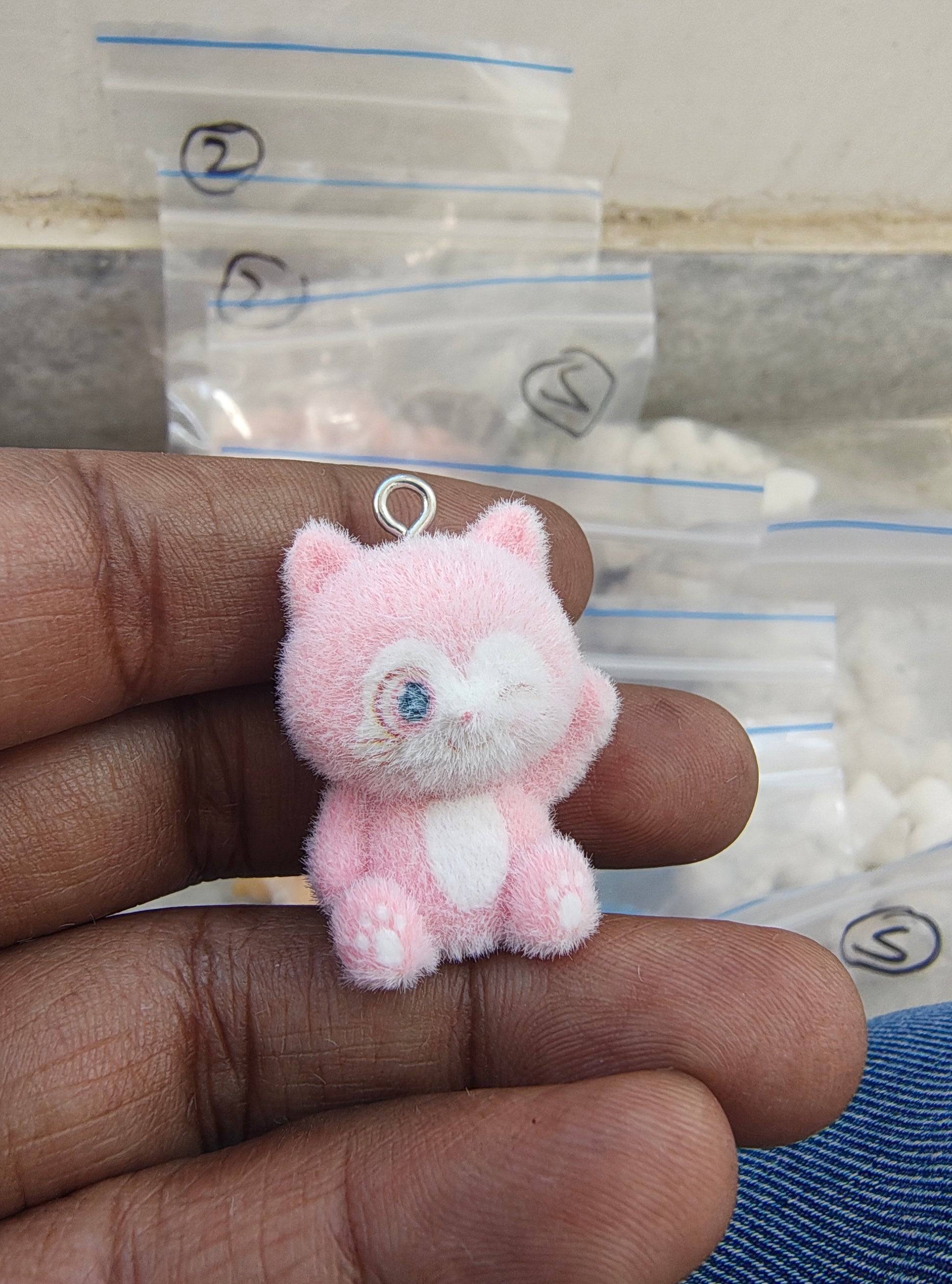 Light pink snitch fur charm