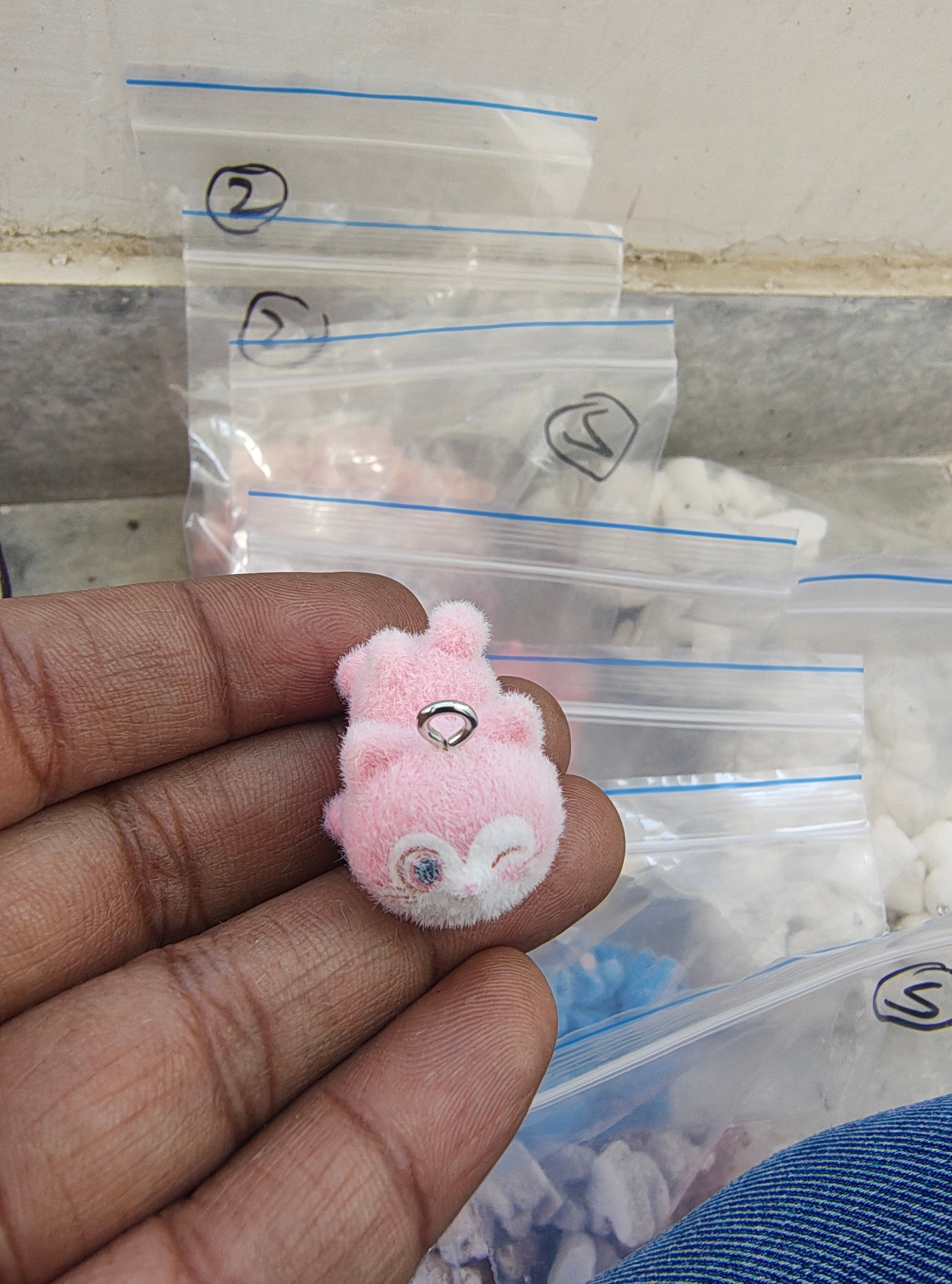 Light pink snitch fur charm