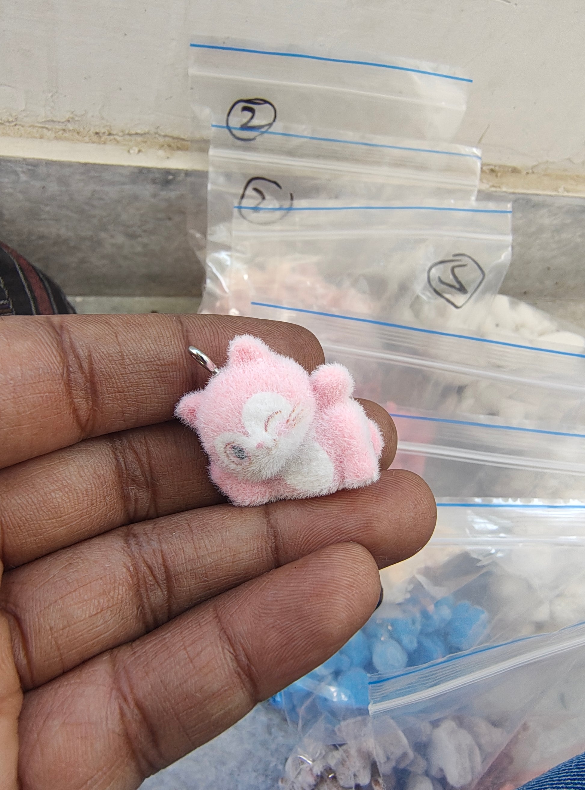 Light pink snitch fur charm