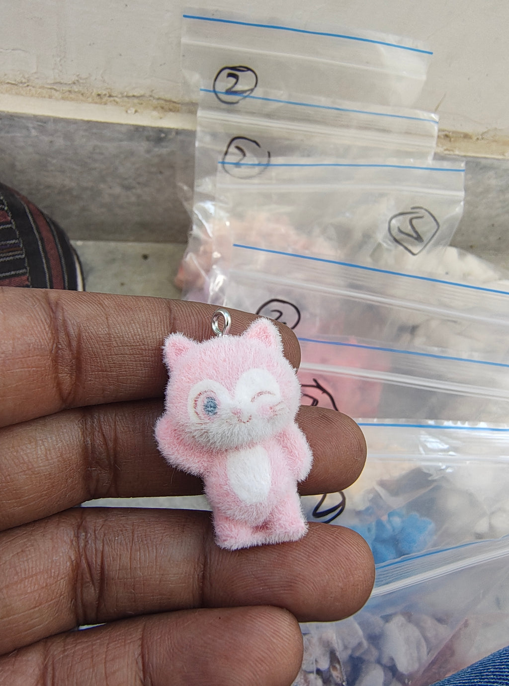 Light pink snitch fur charm