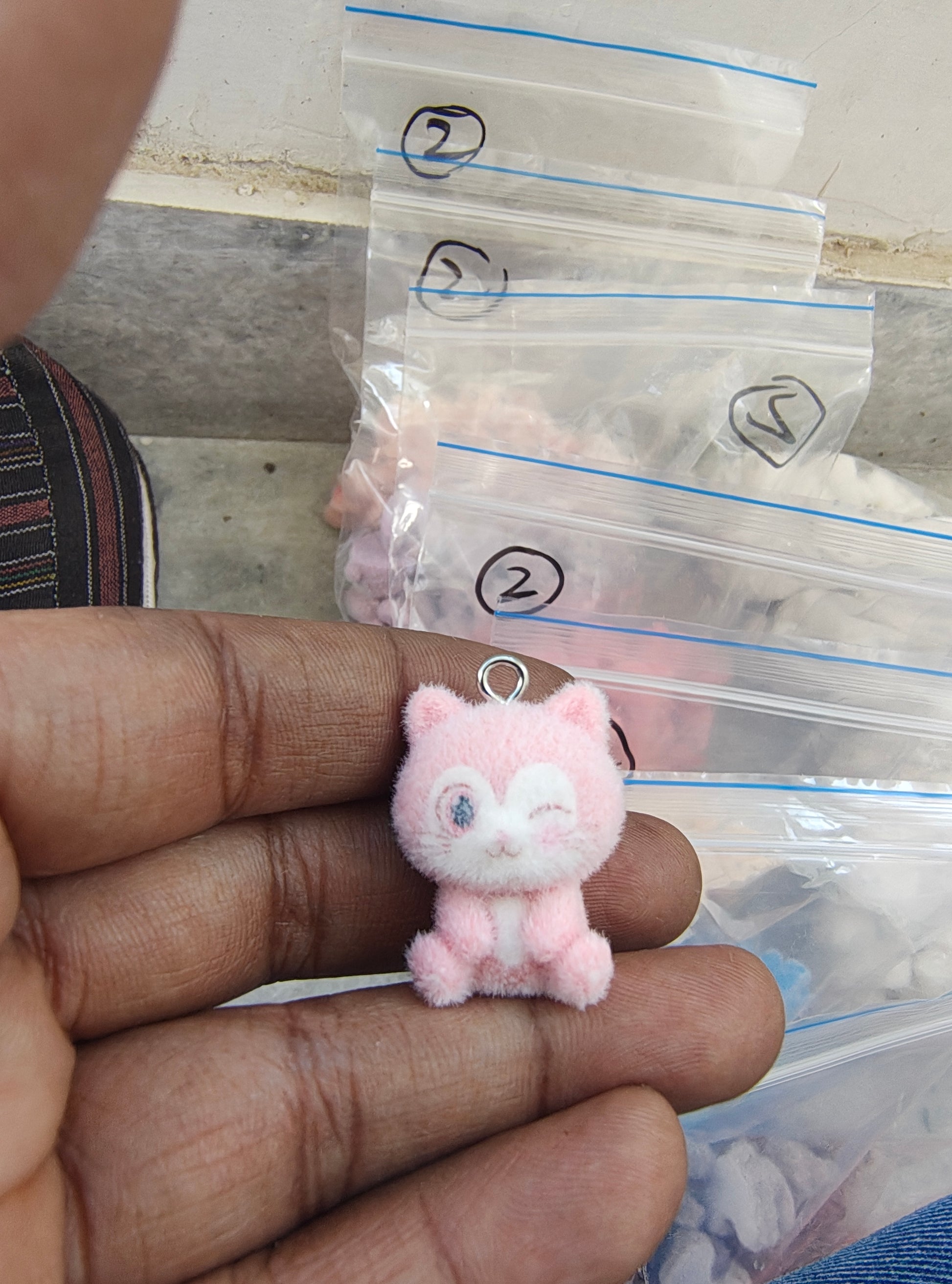 Light pink snitch fur charm