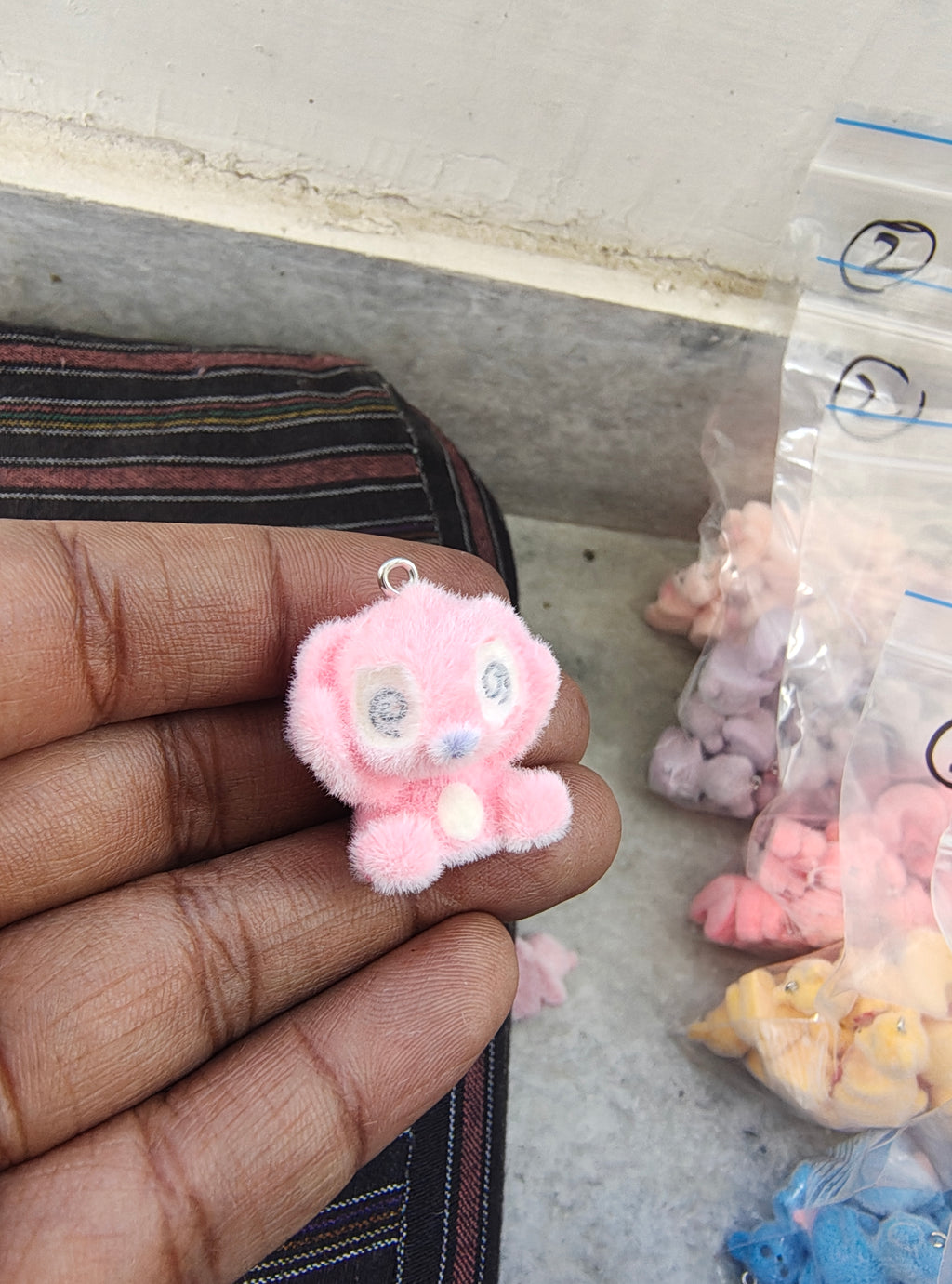 Pink snitch fur charm