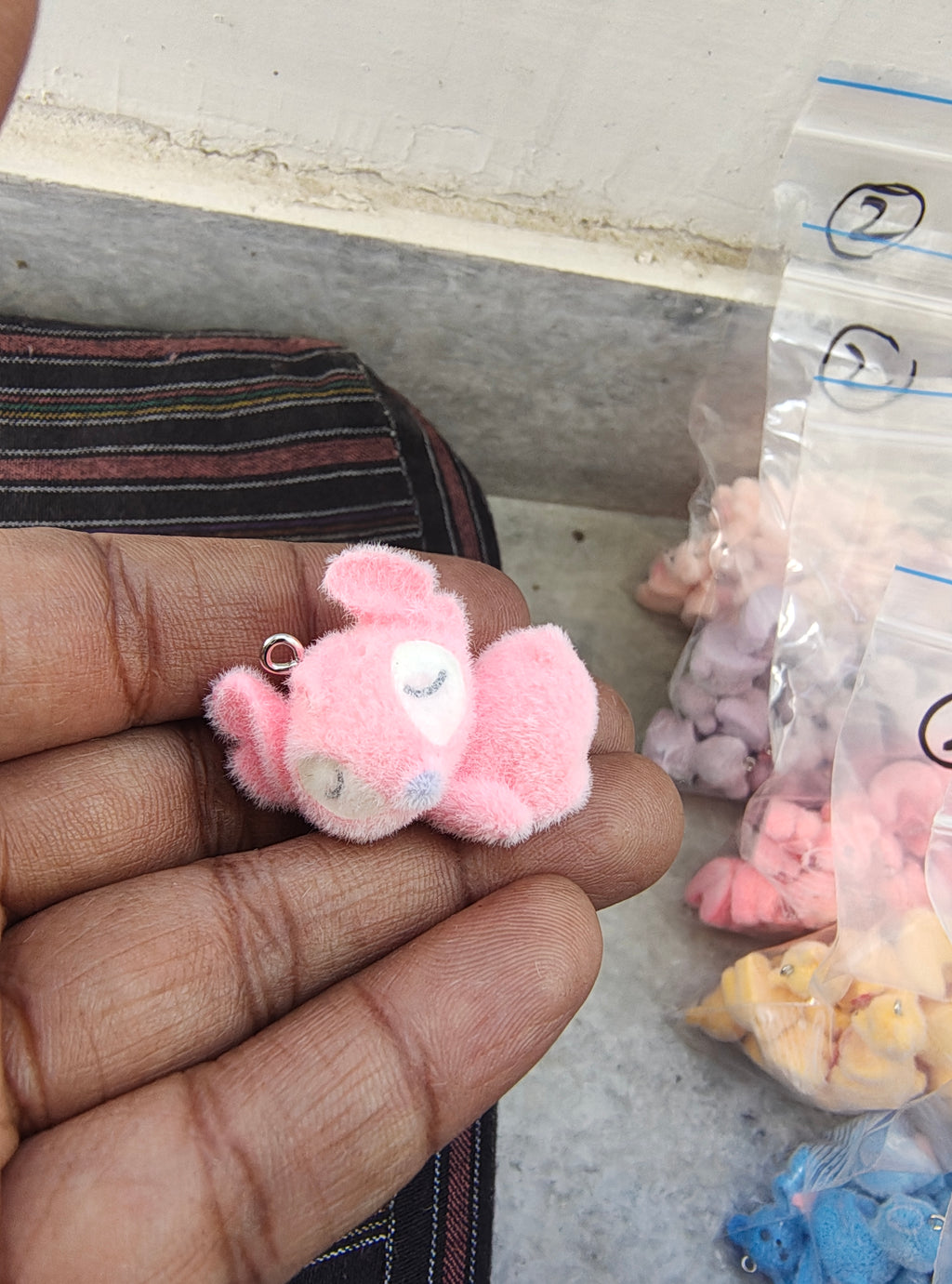 Pink snitch fur charm