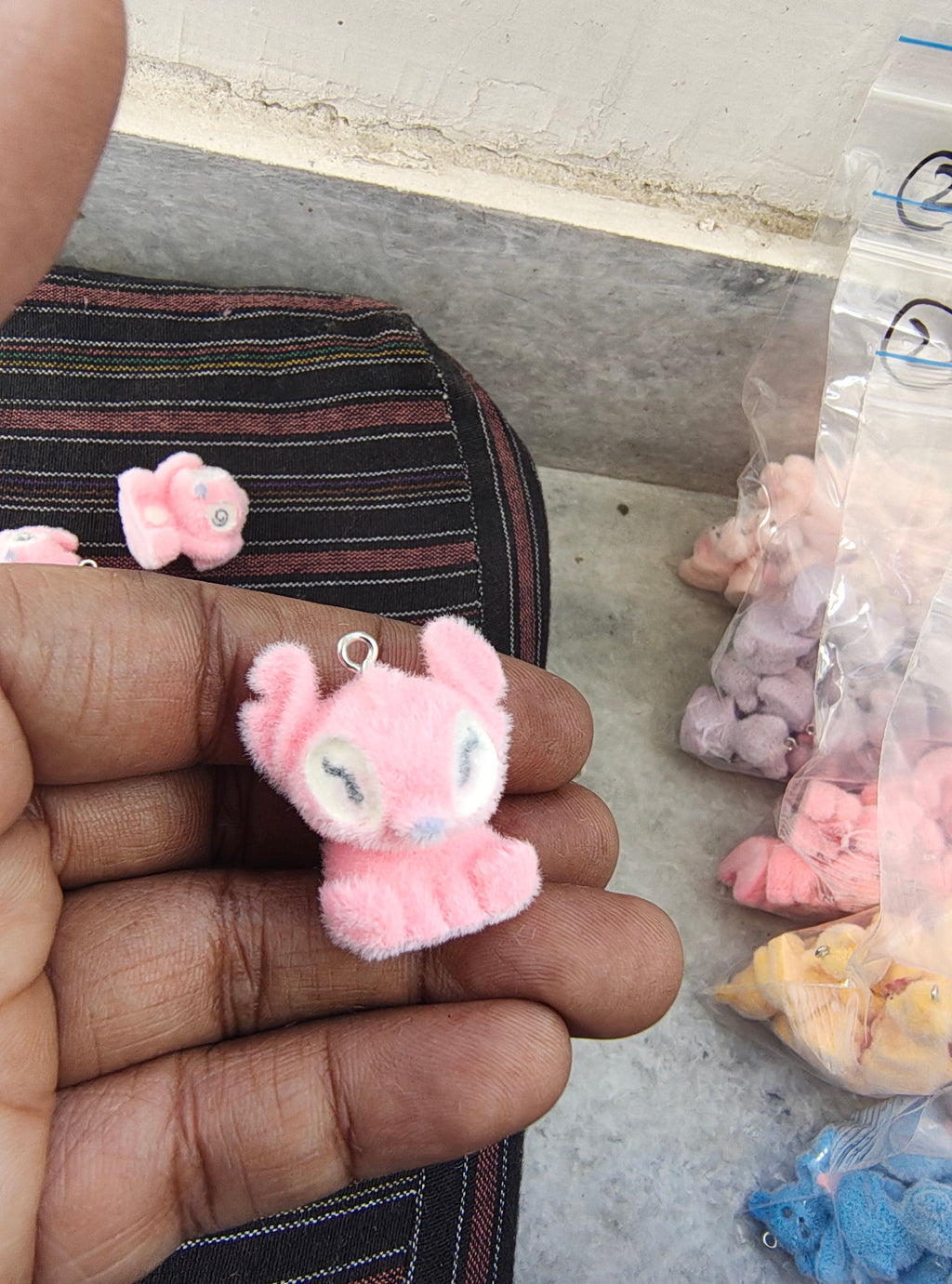 Pink snitch fur charm