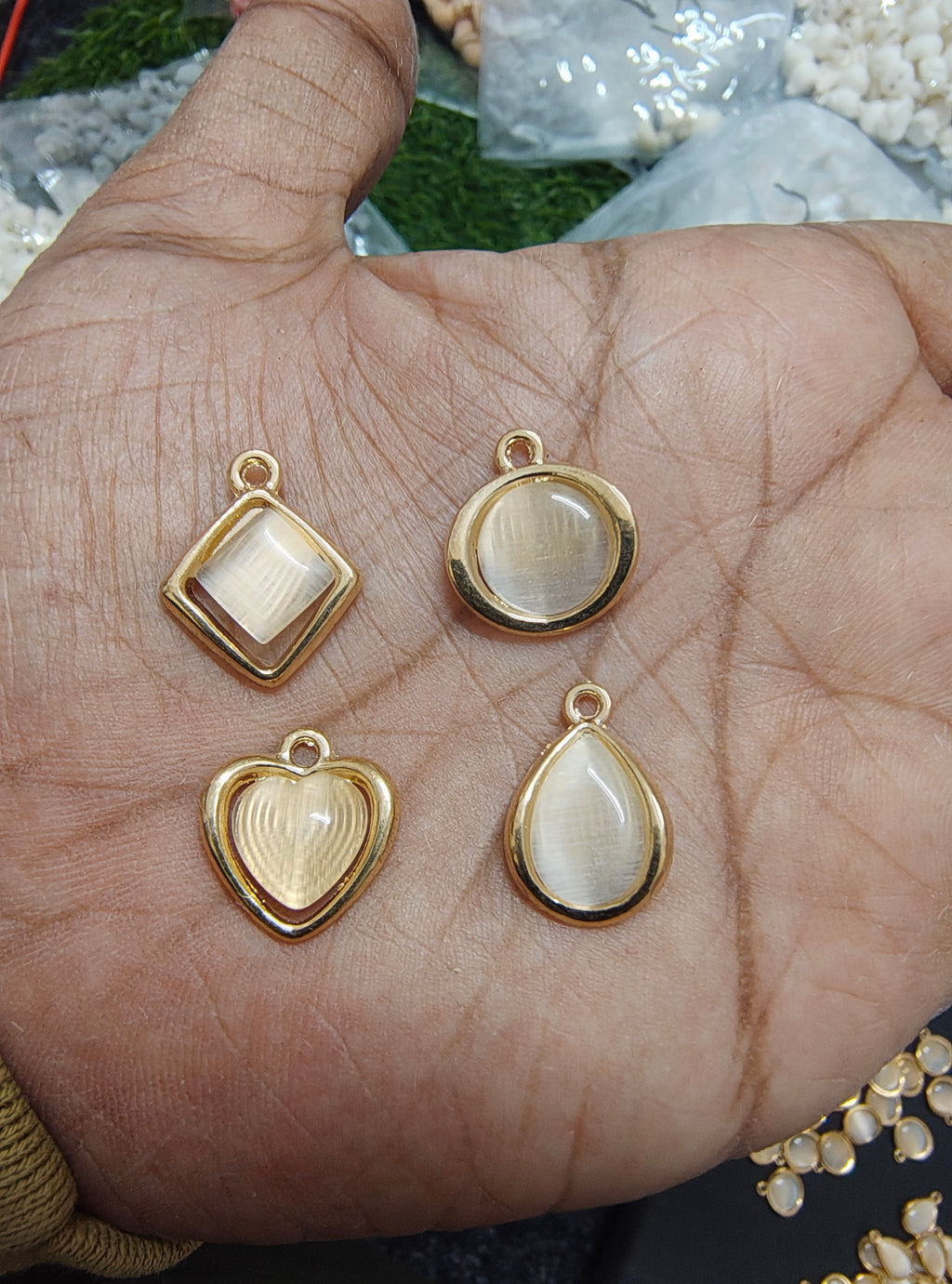 Golden off-white stone charm