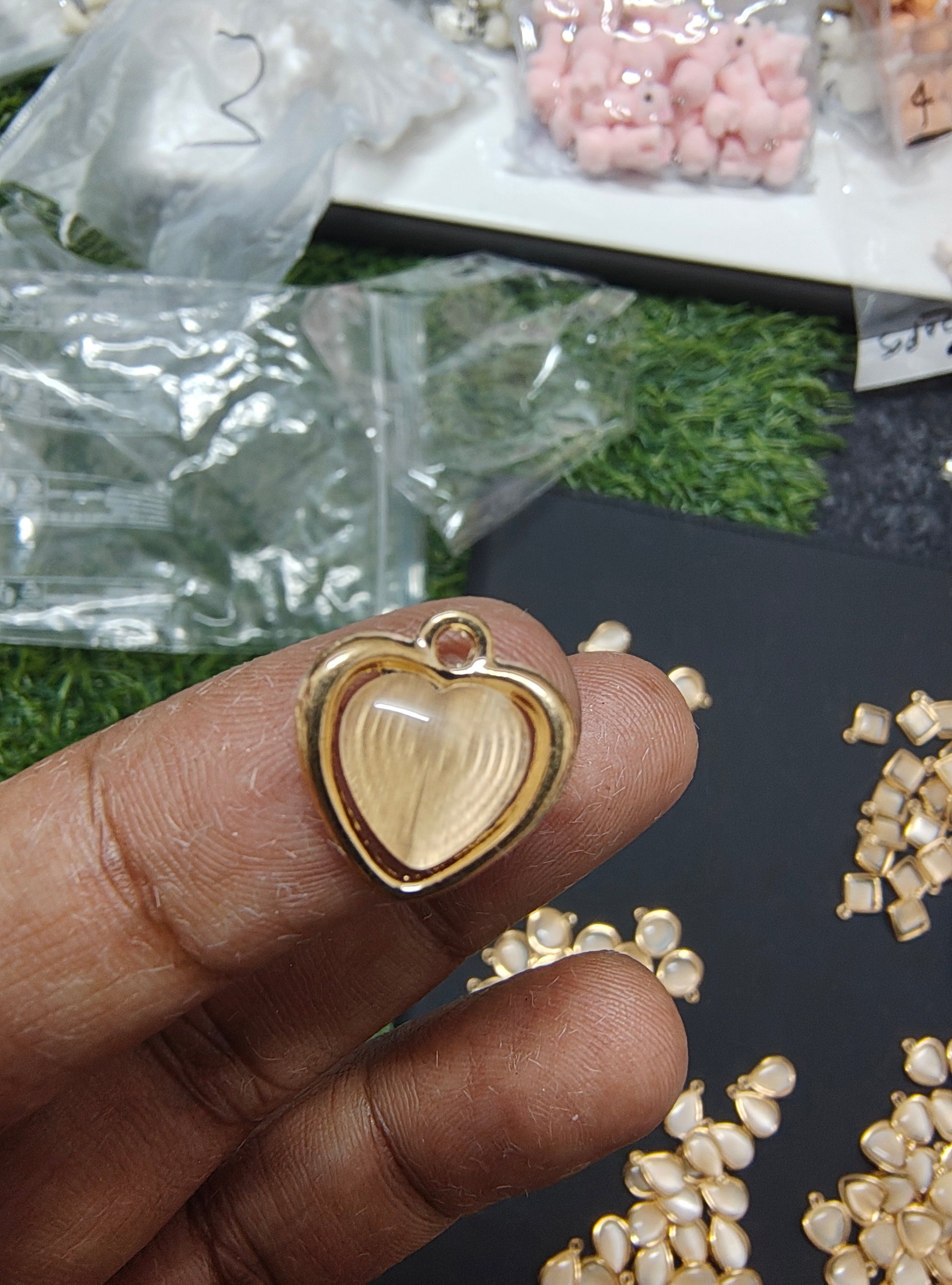 Golden off-white stone charm