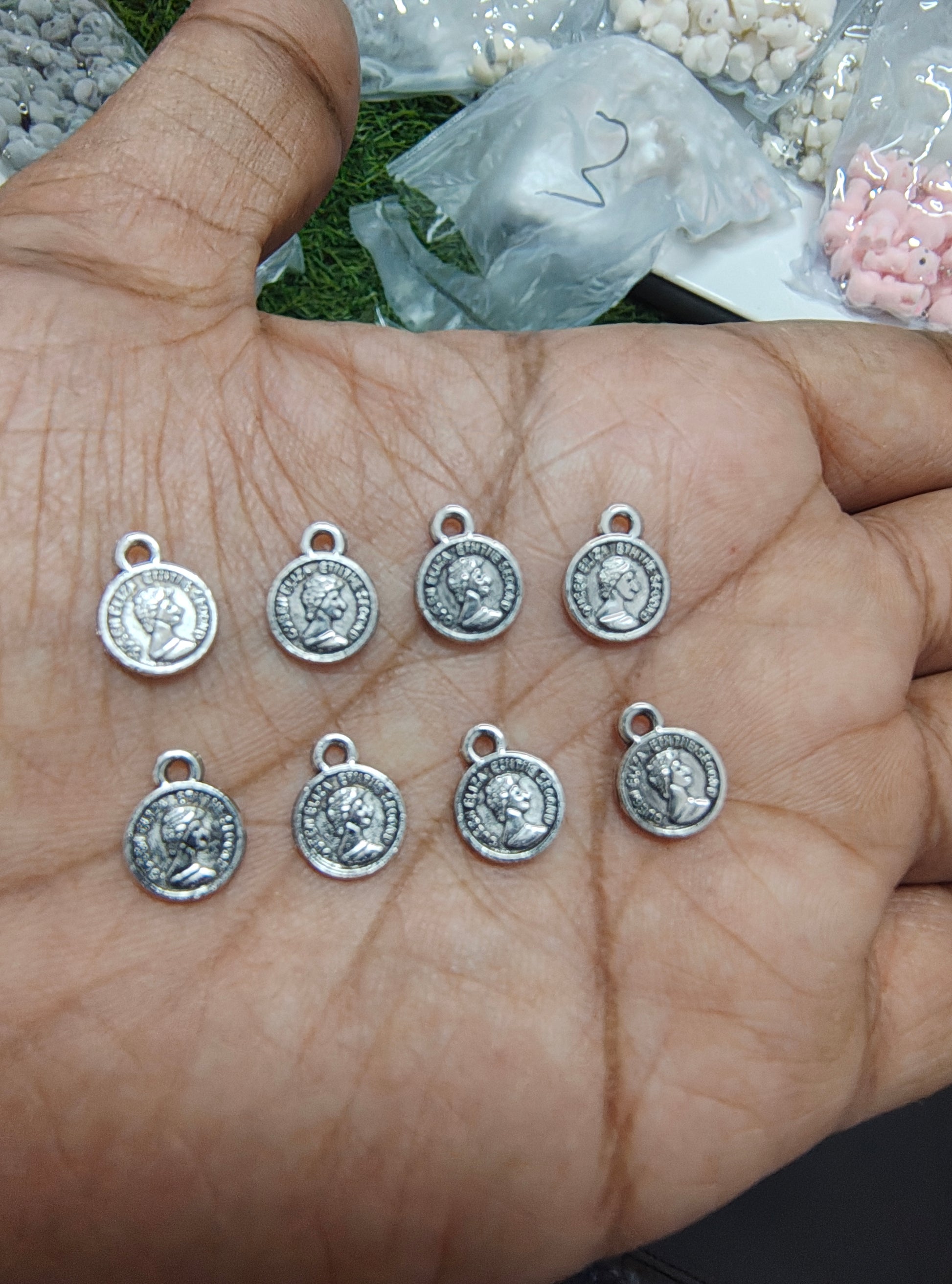 Small metal coin charm