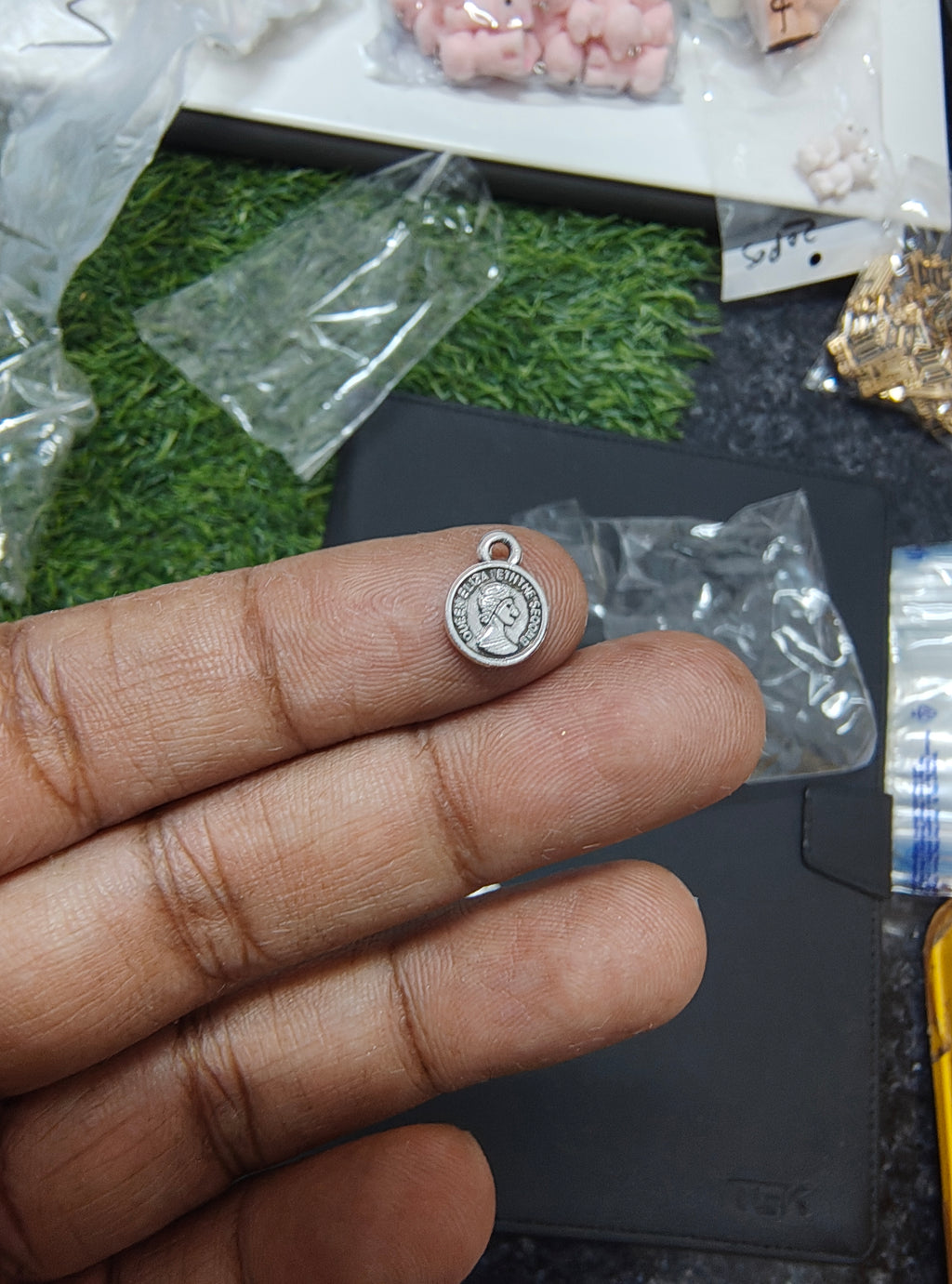 Small metal coin charm