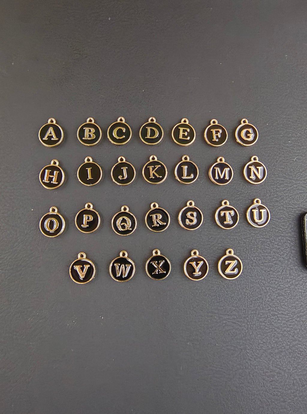 Round black alphabet charm ( atoz set) ( EC1096 )