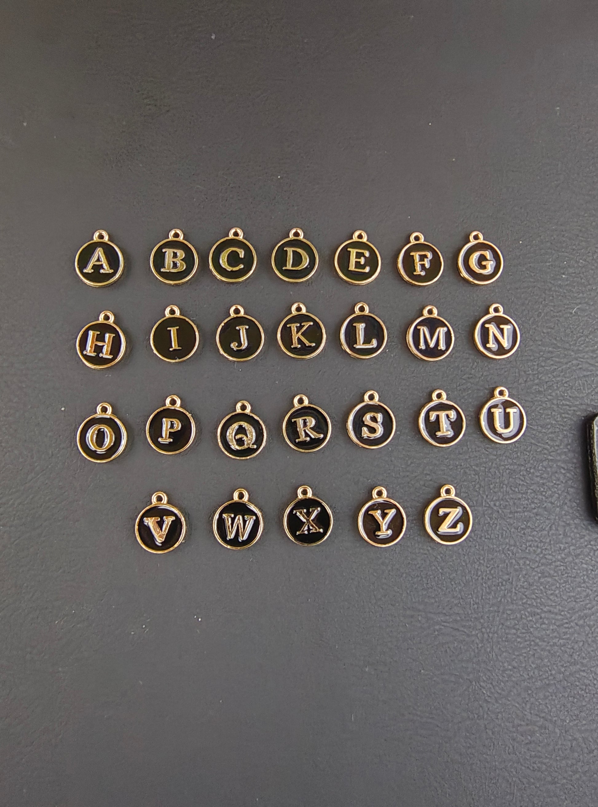 Round black alphabet charm ( atoz set) ( EC1096 )